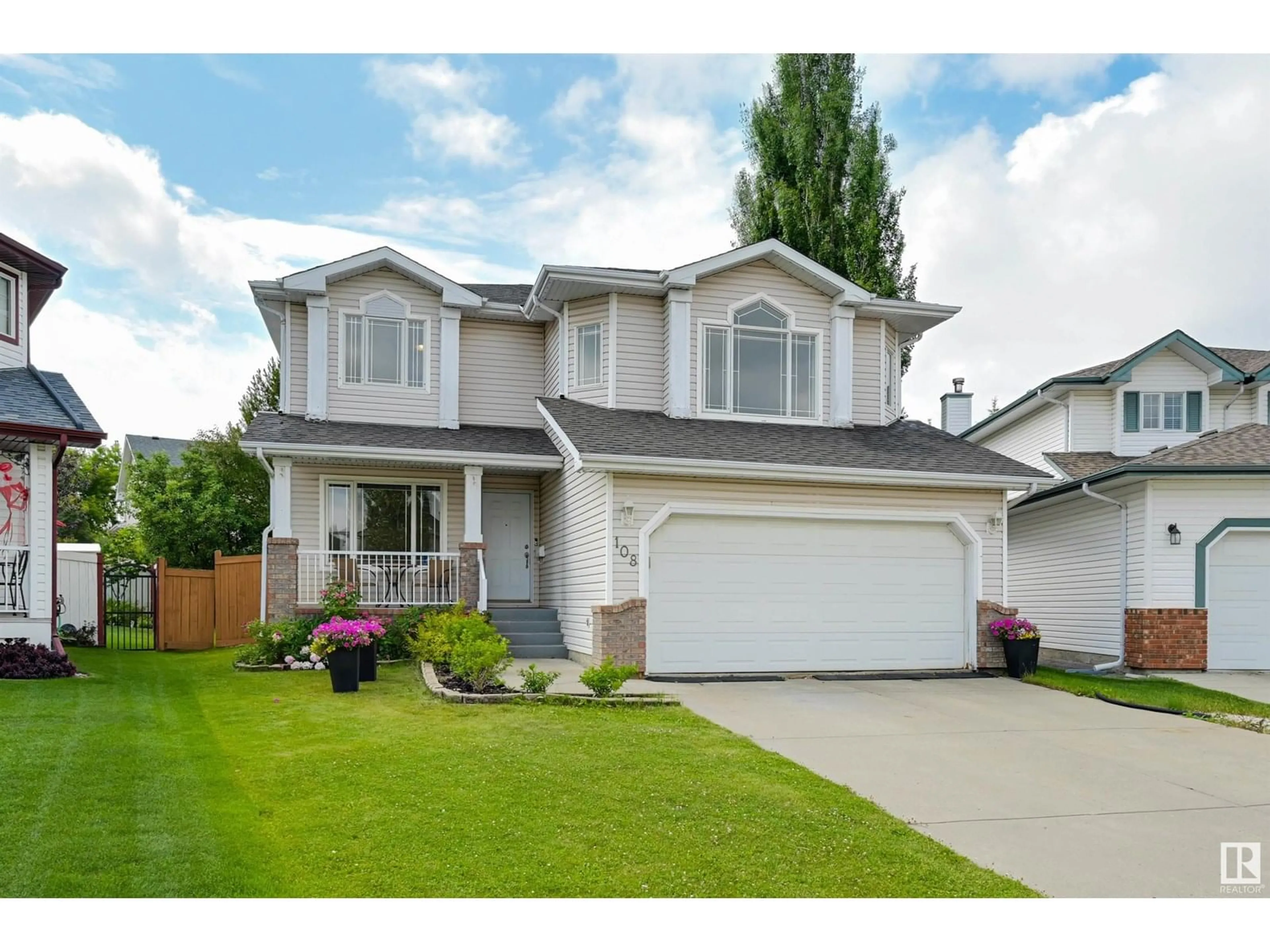 Home with vinyl exterior material, street for 108 DECHENE RD, Edmonton Alberta T6M2M9