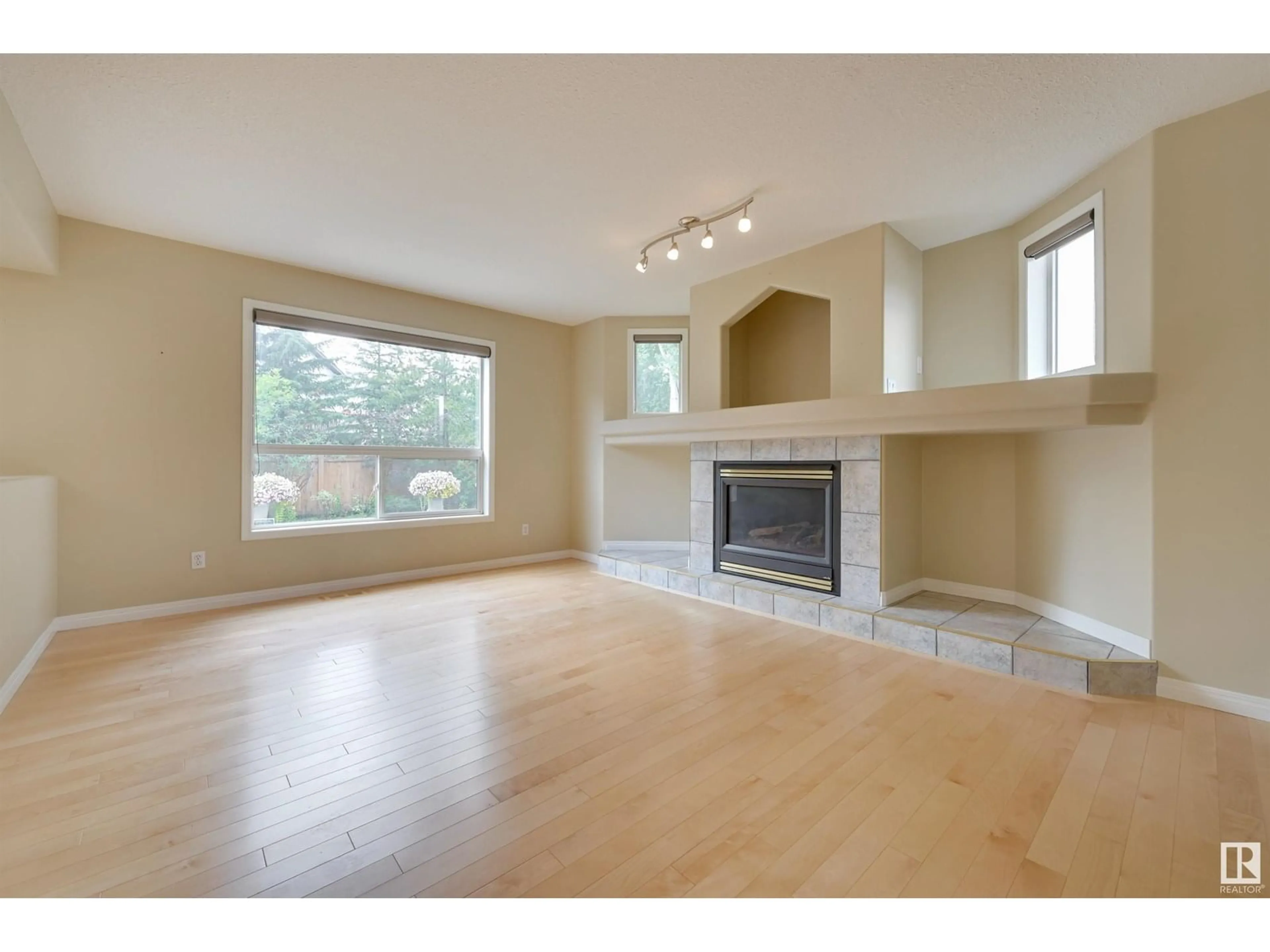 Living room with furniture, wood/laminate floor for 108 DECHENE RD, Edmonton Alberta T6M2M9