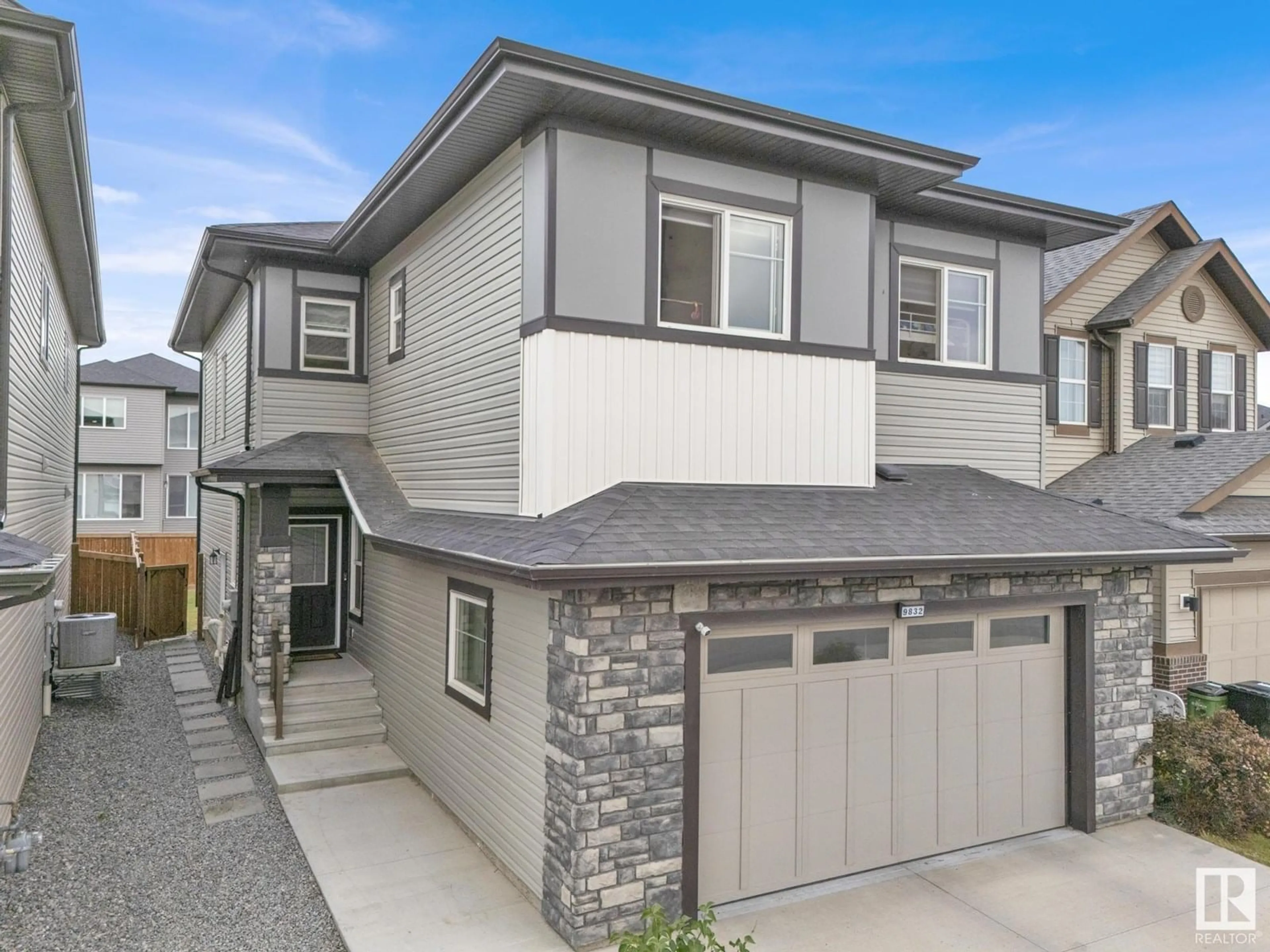 Home with vinyl exterior material, street for NW - 9832 225 ST, Edmonton Alberta T5T7C1