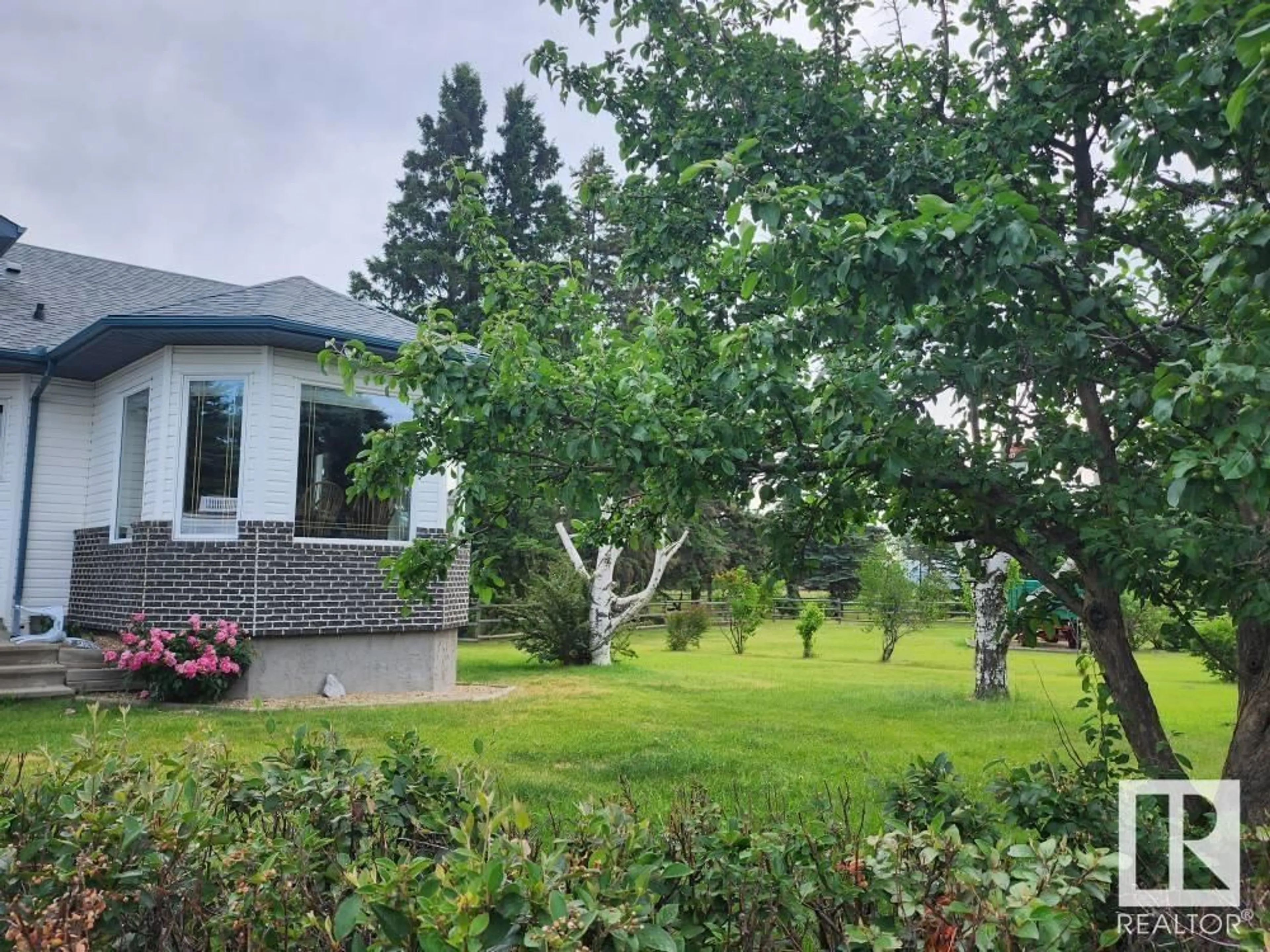 A pic from outside/outdoor area/front of a property/back of a property/a pic from drone, forest/trees view for 49238 RGE ROAD 253, Rural Leduc County Alberta T9E6M1