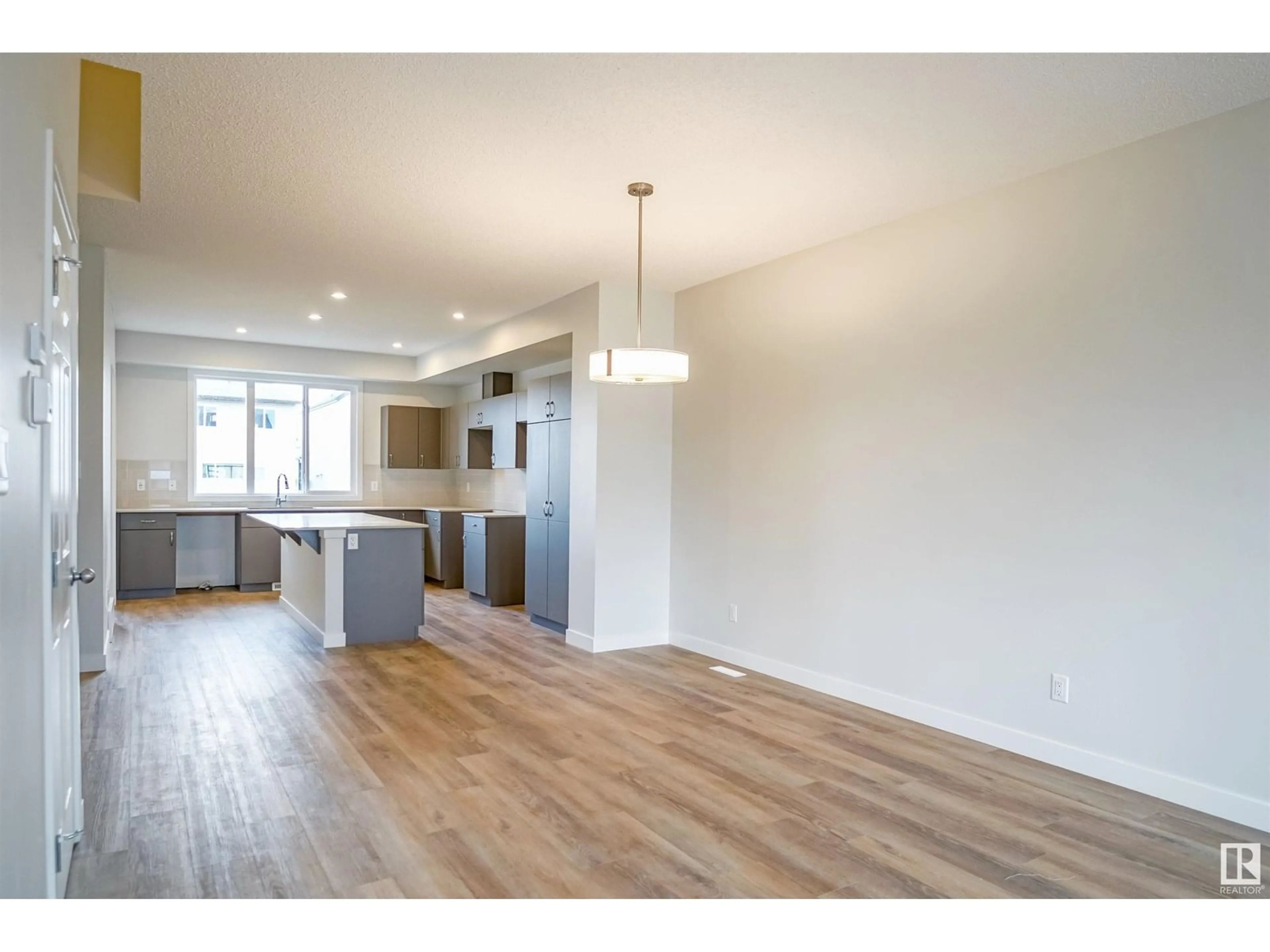 Open concept kitchen, wood/laminate floor for 18153 73A ST, Edmonton Alberta T5Z0T4
