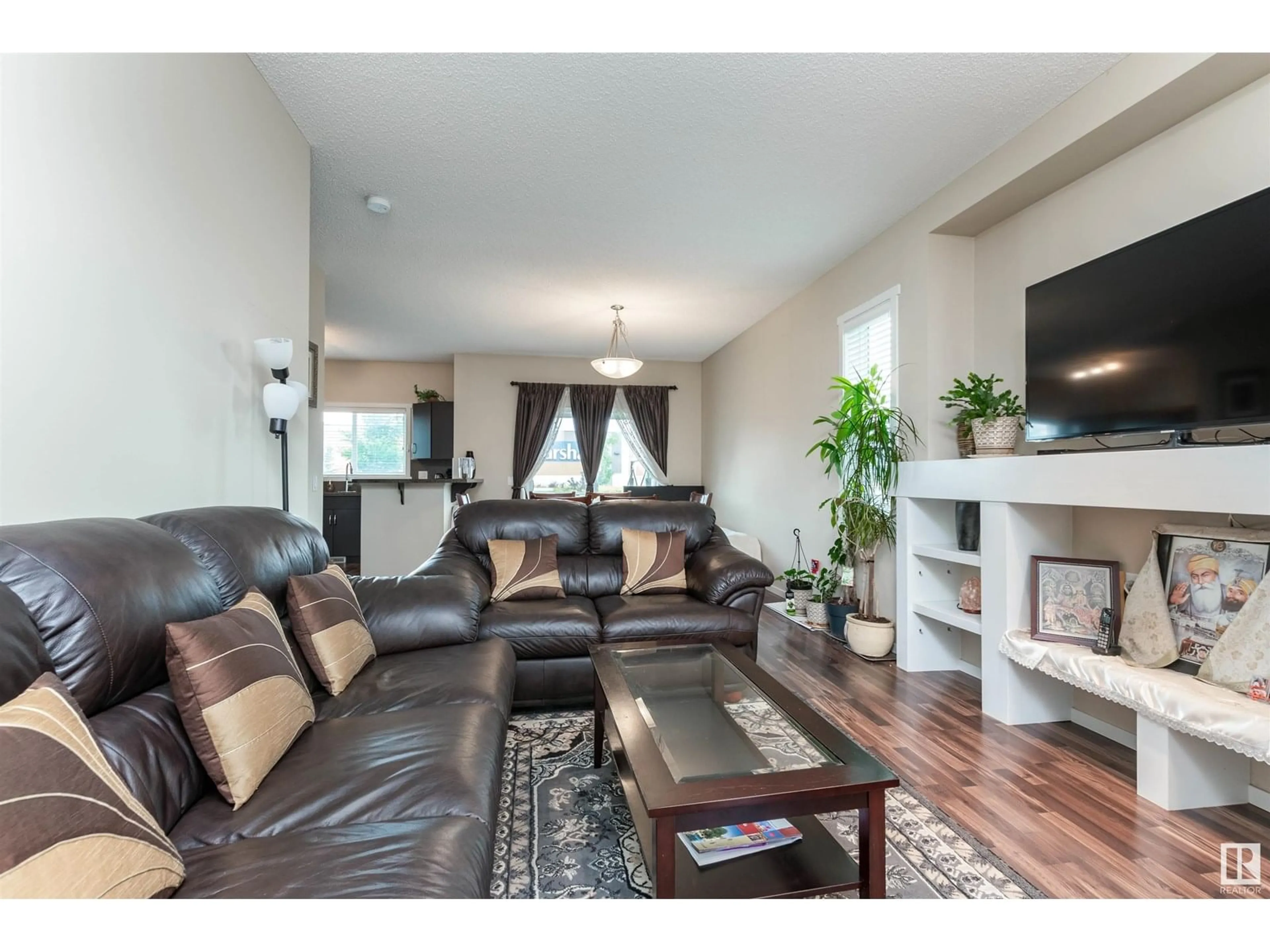 Living room with furniture, wood/laminate floor for 7526 ELLESMERE WY, Sherwood Park Alberta T8H0P6