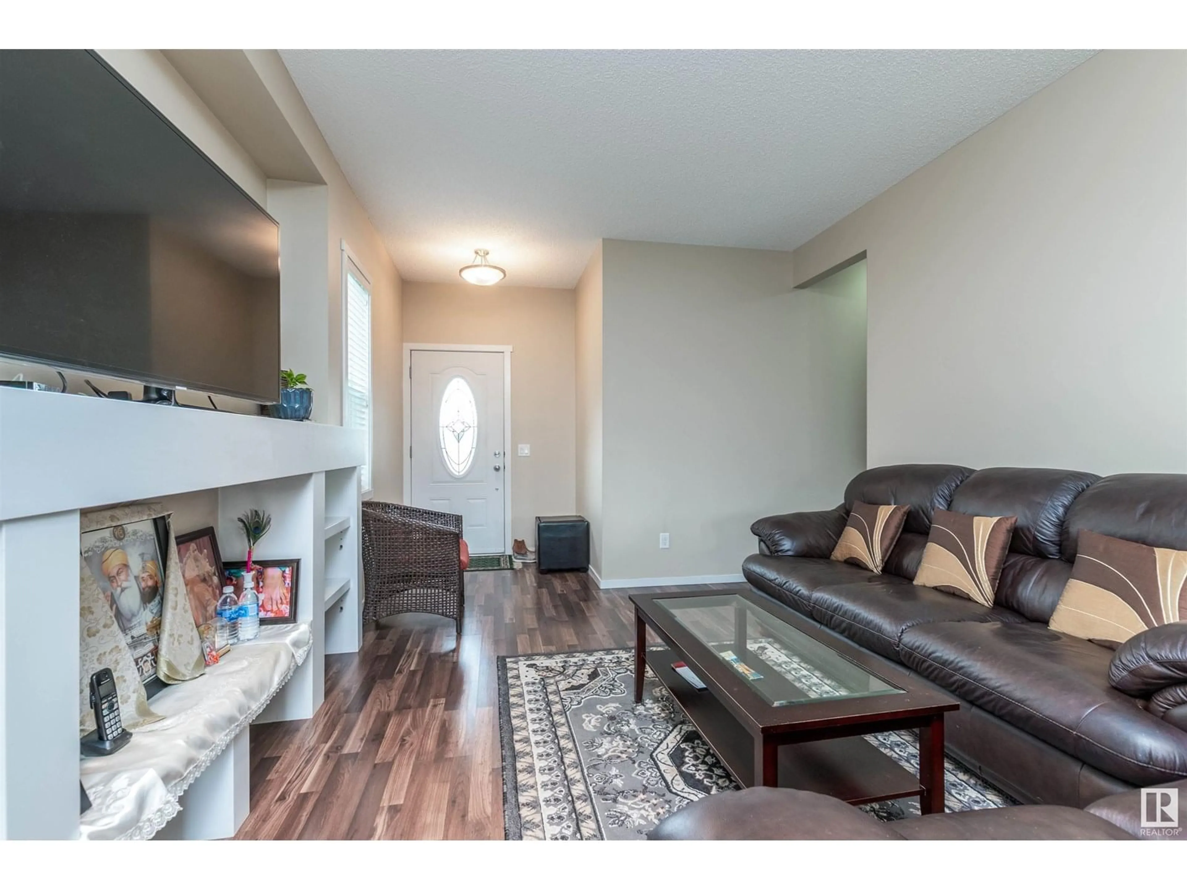Living room with furniture, wood/laminate floor for 7526 ELLESMERE WY, Sherwood Park Alberta T8H0P6