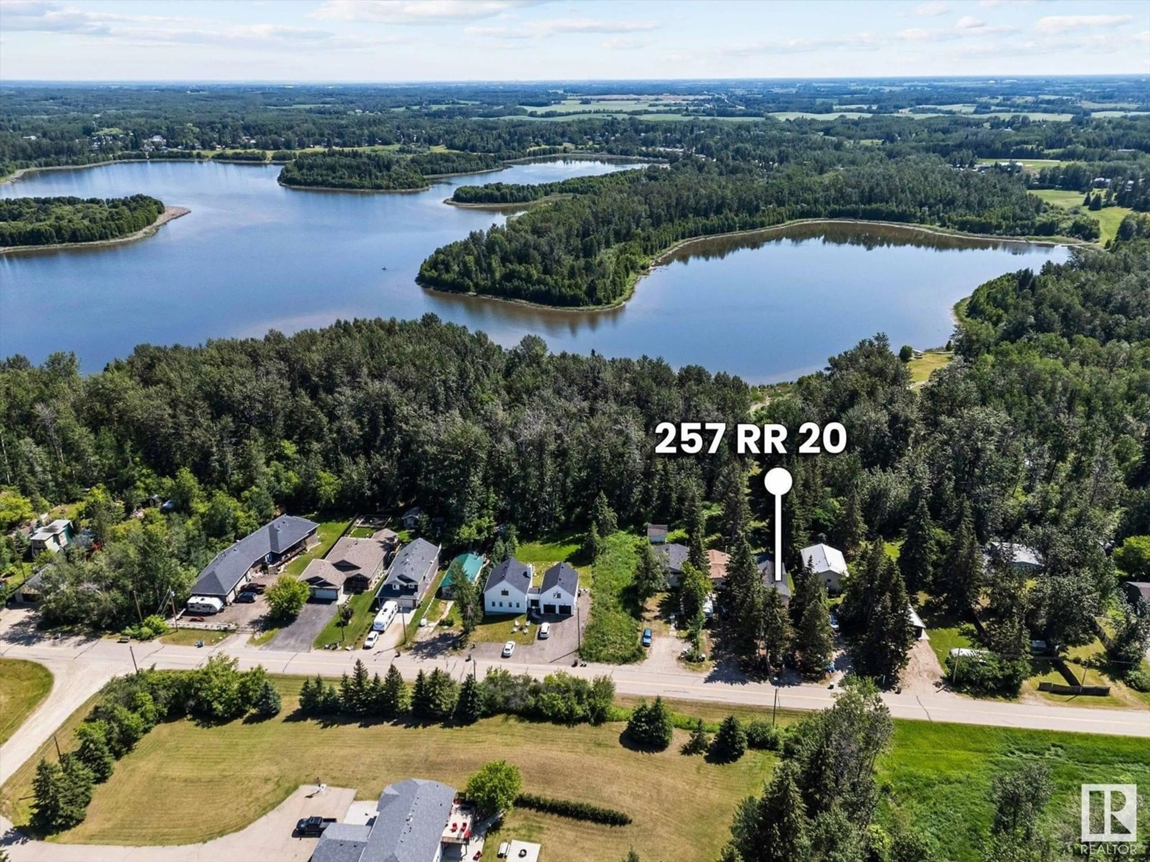 A pic from outside/outdoor area/front of a property/back of a property/a pic from drone, water/lake/river/ocean view for 257 RGE RD 20, Rural Parkland County Alberta T7Z2V2