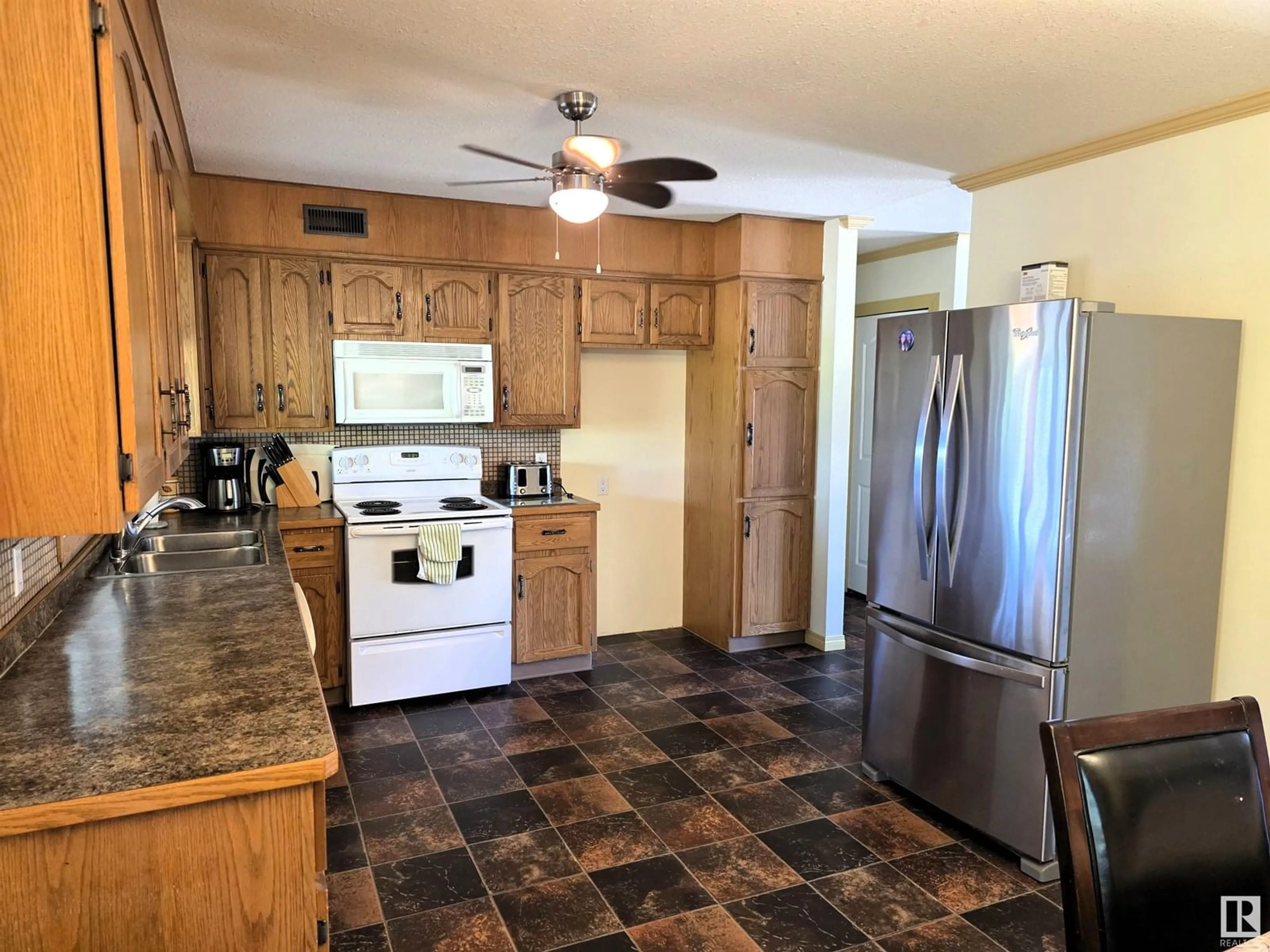 Standard kitchen, ceramic/tile floor for 5025 49 STREET, Fort Kent Alberta T9N1H0