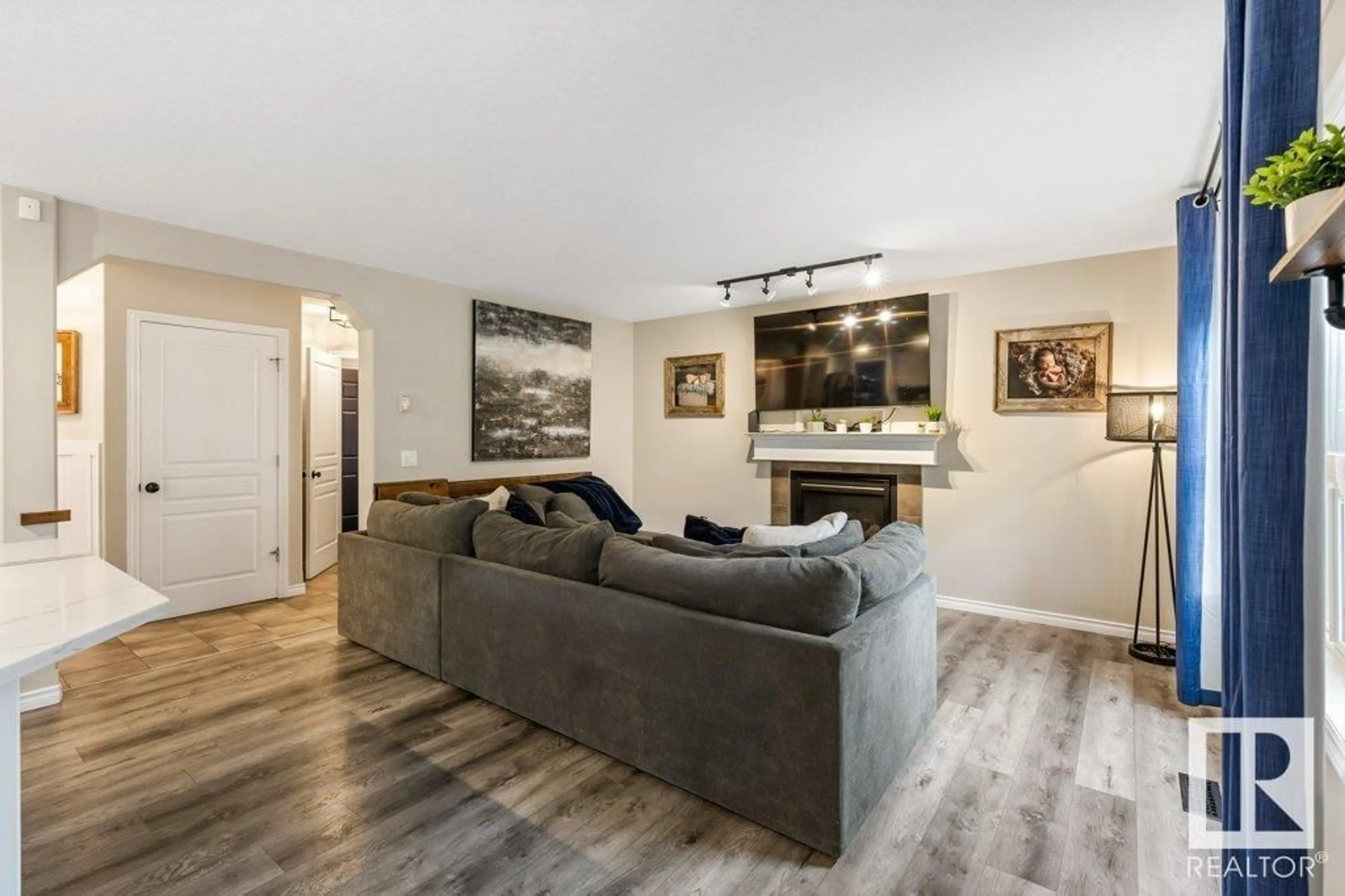 Living room with furniture, wood/laminate floor for 24 NAPOLEON CR, St. Albert Alberta T8N1C6