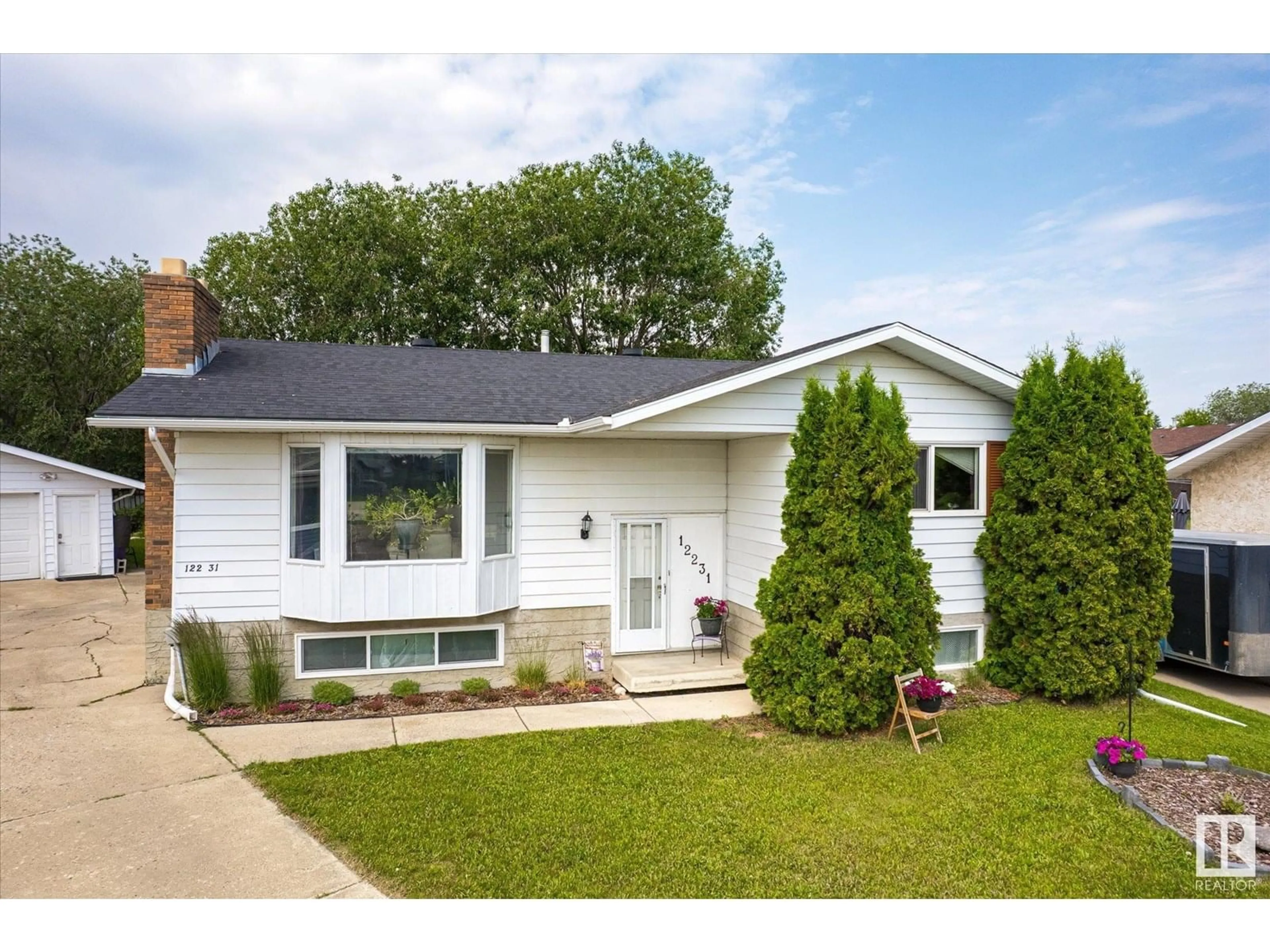 Home with vinyl exterior material, street for 12231 152A AV, Edmonton Alberta T5X1P9