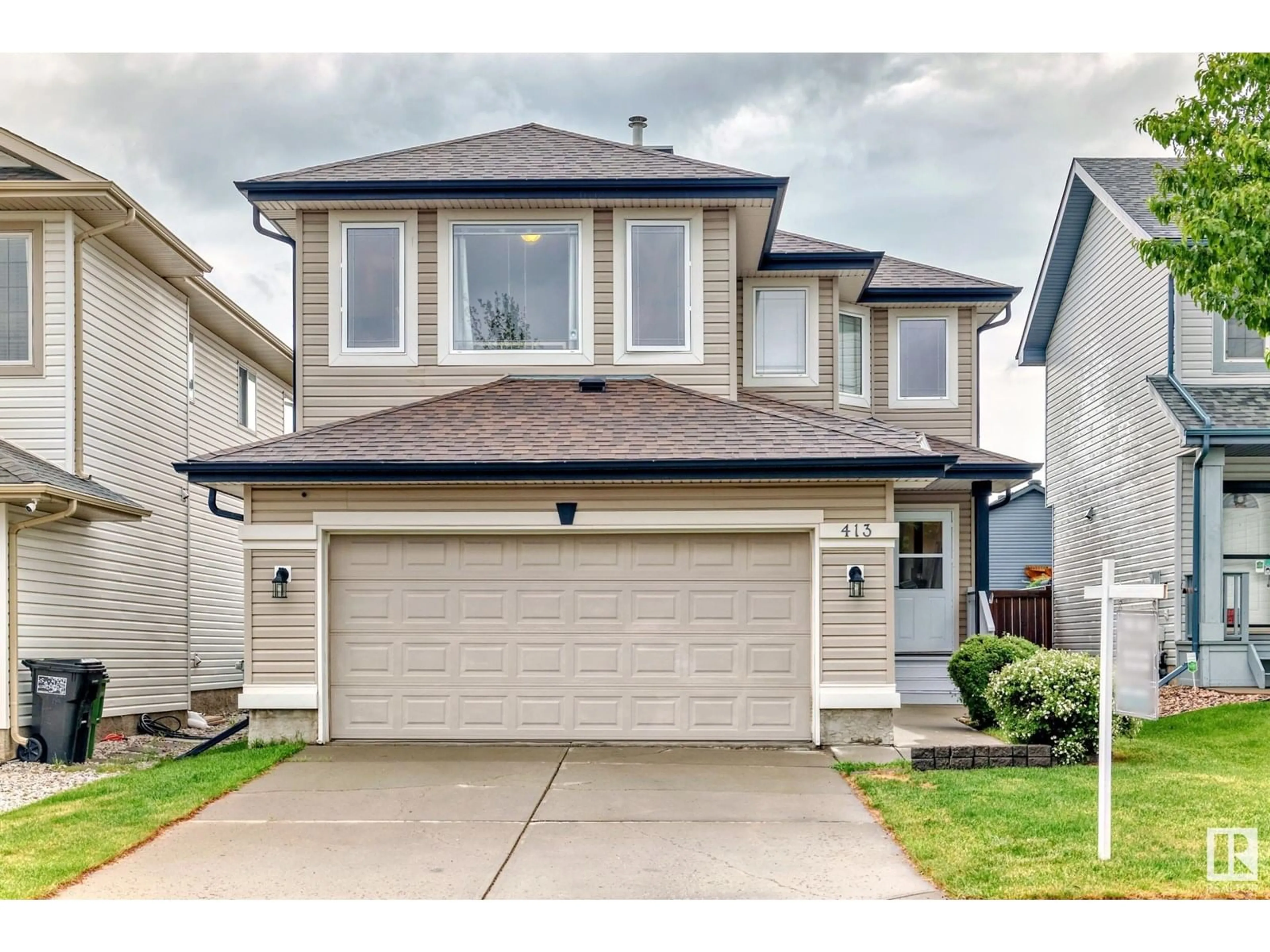Home with vinyl exterior material, street for 413 85 ST, Edmonton Alberta T6X1H7