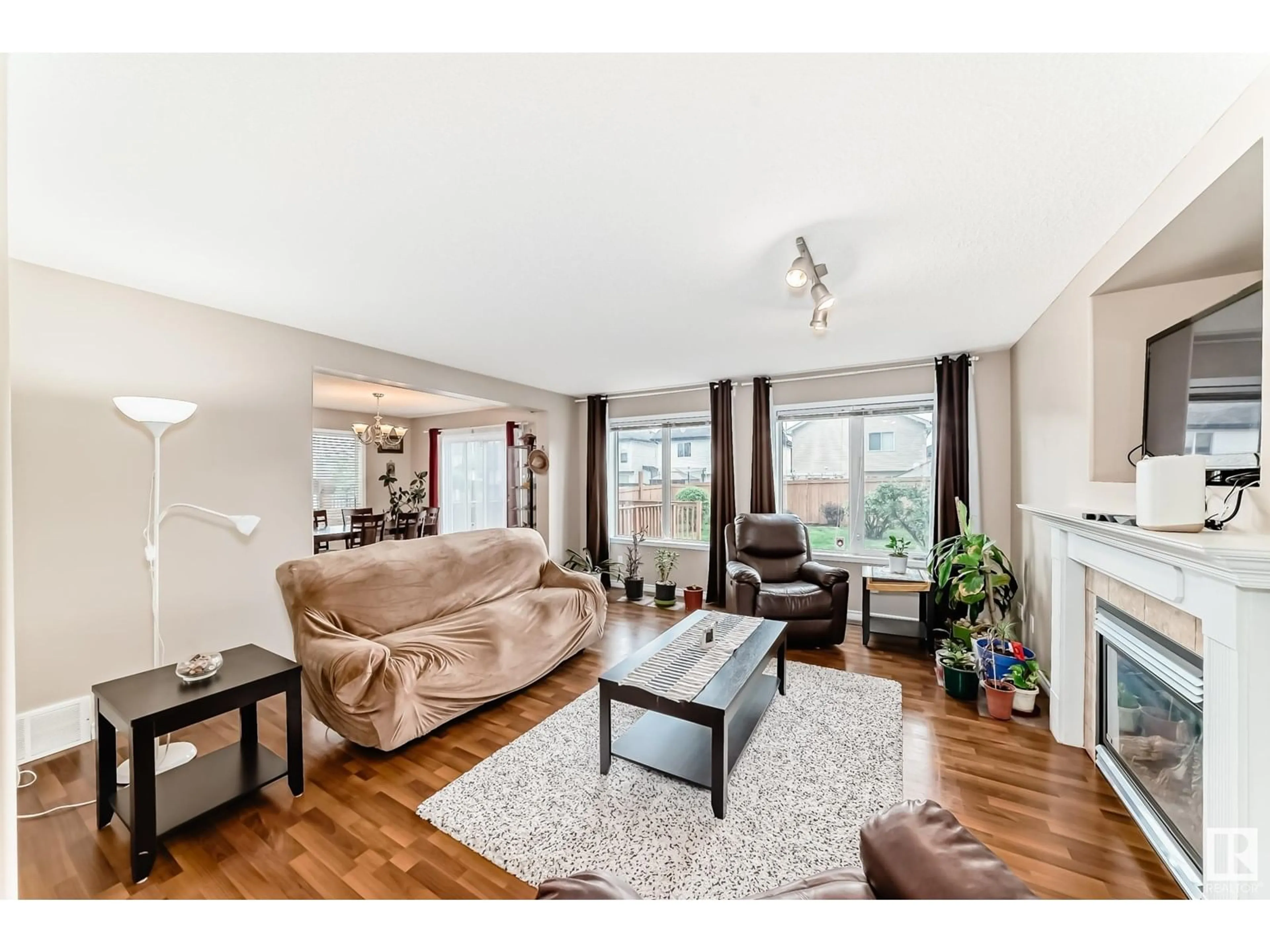 Living room with furniture, wood/laminate floor for 413 85 ST, Edmonton Alberta T6X1H7