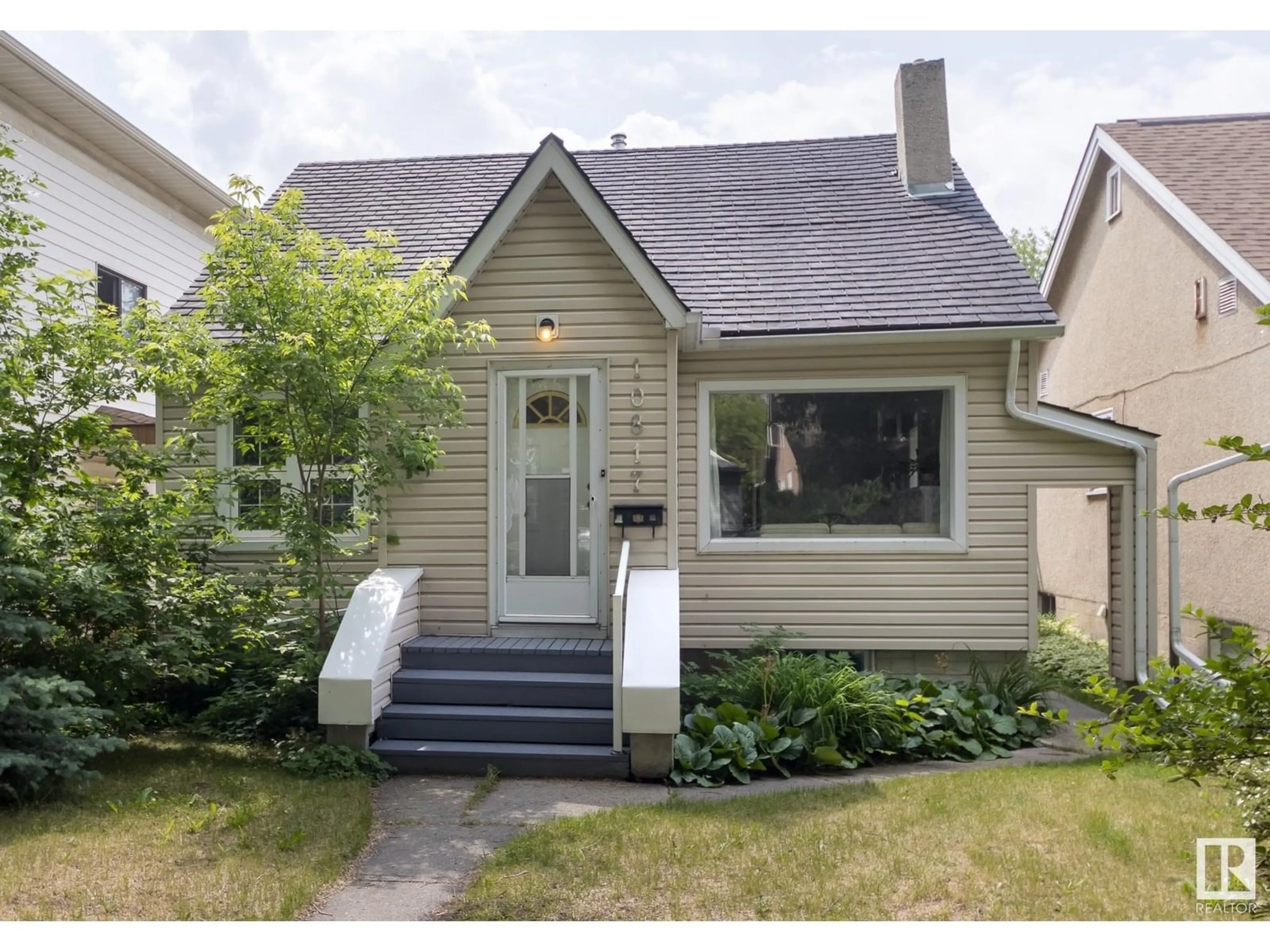Home with vinyl exterior material, street for 10817 79 AV, Edmonton Alberta T6E1S6