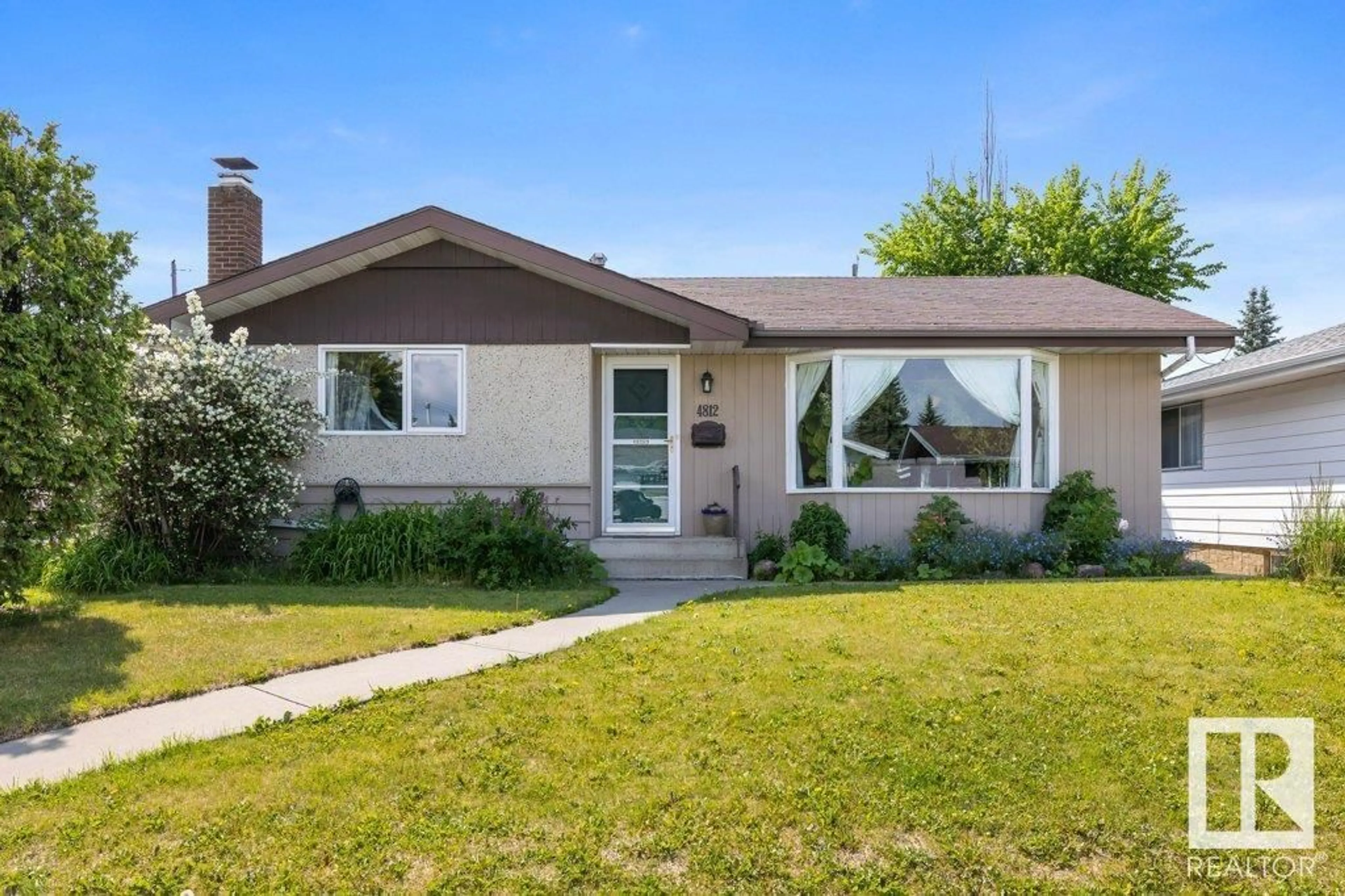 Home with vinyl exterior material, street for NW - 4812 115A ST, Edmonton Alberta T6H3P8