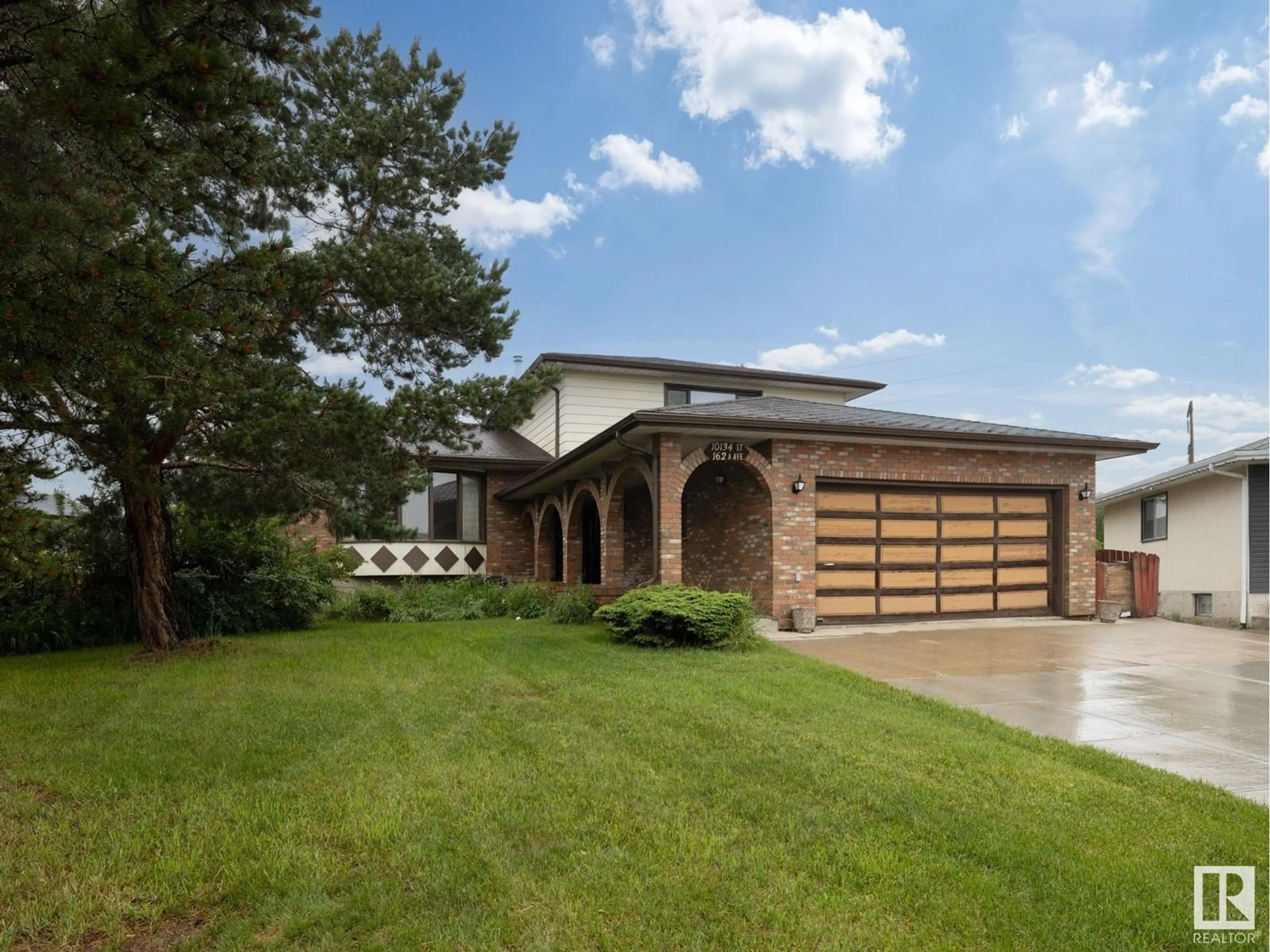 Home with brick exterior material, street for 10134 162A AV, Edmonton Alberta T5X2G2