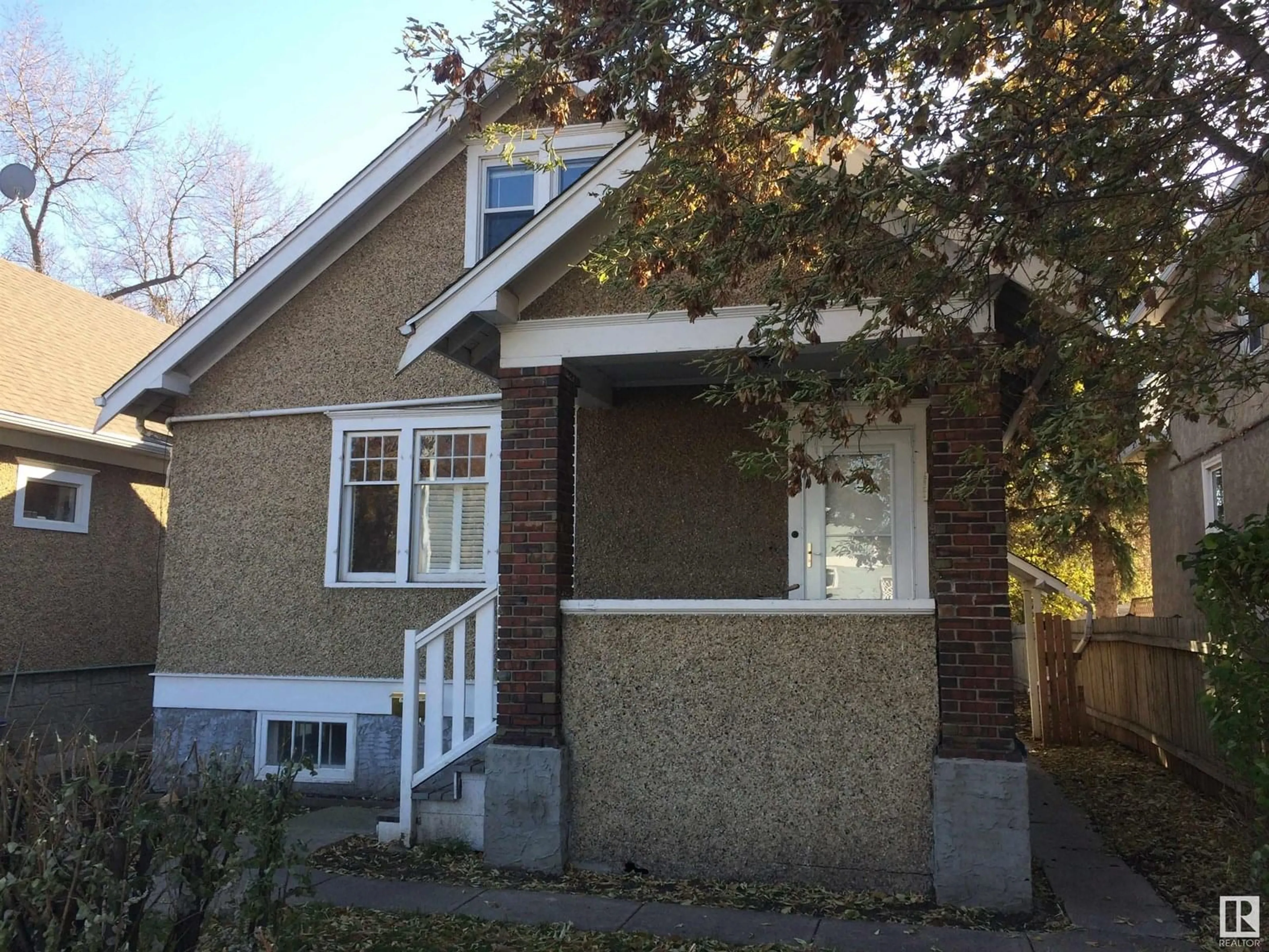 Home with brick exterior material, street for 12605 107 AV, Edmonton Alberta T5M1Z5