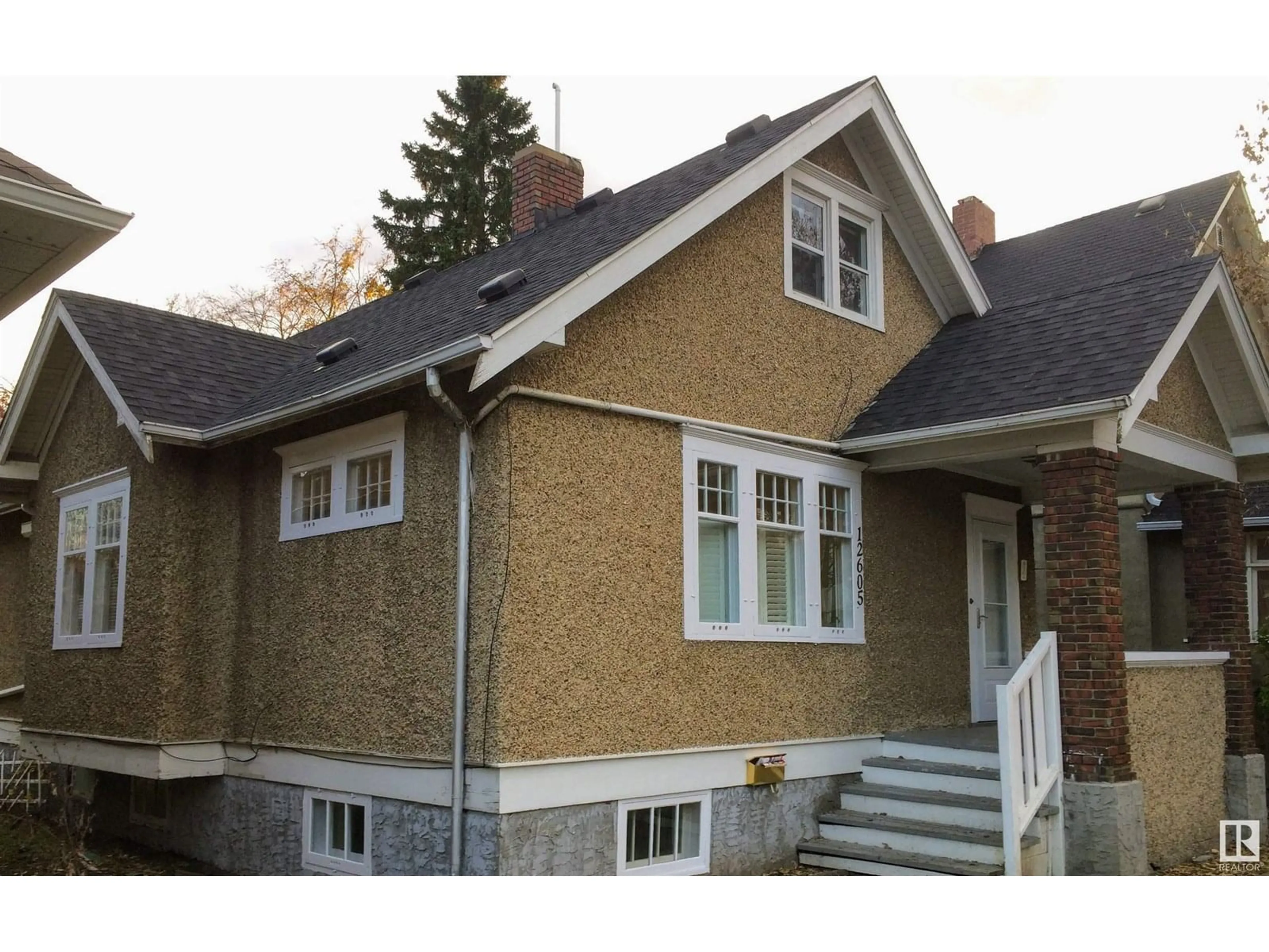 Home with vinyl exterior material, building for 12605 107 AV, Edmonton Alberta T5M1Z5
