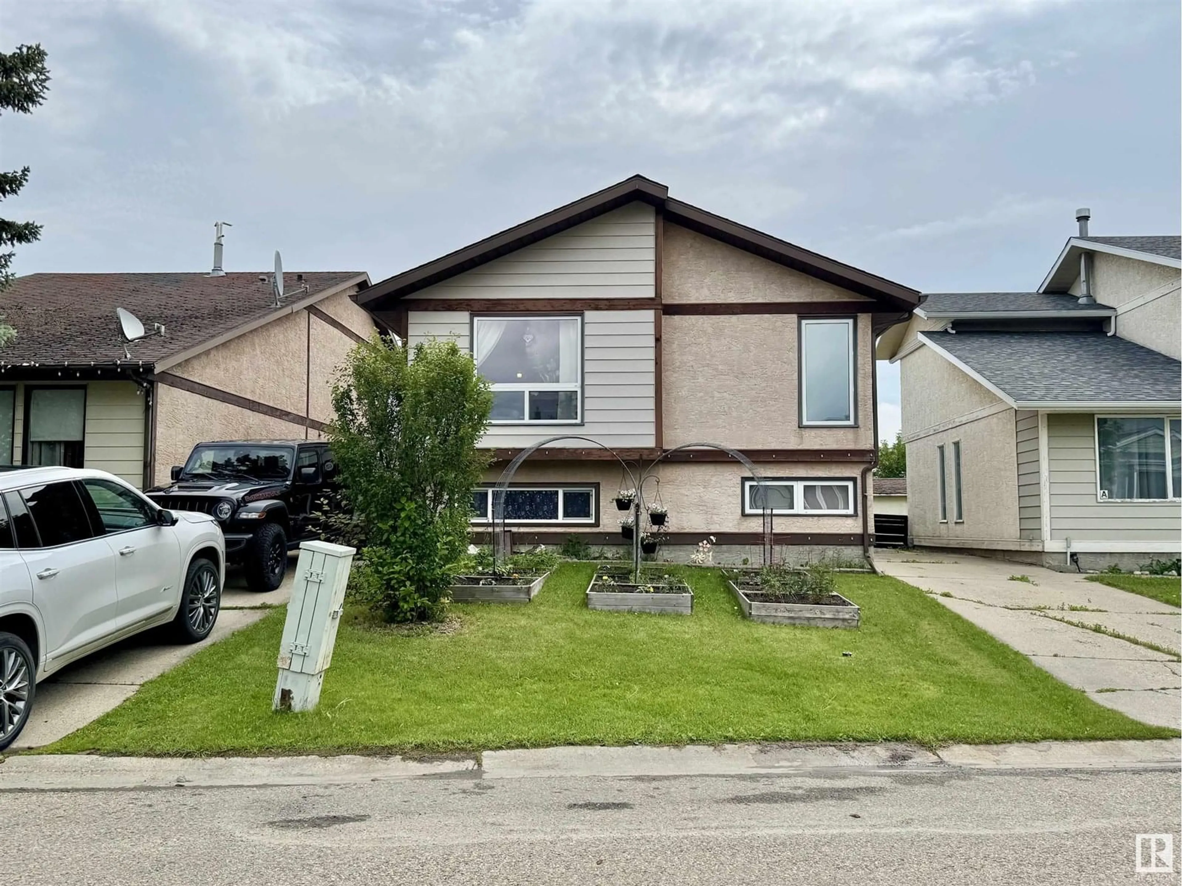 Home with vinyl exterior material, street for 4325 55 ST, Drayton Valley Alberta T7A1K4
