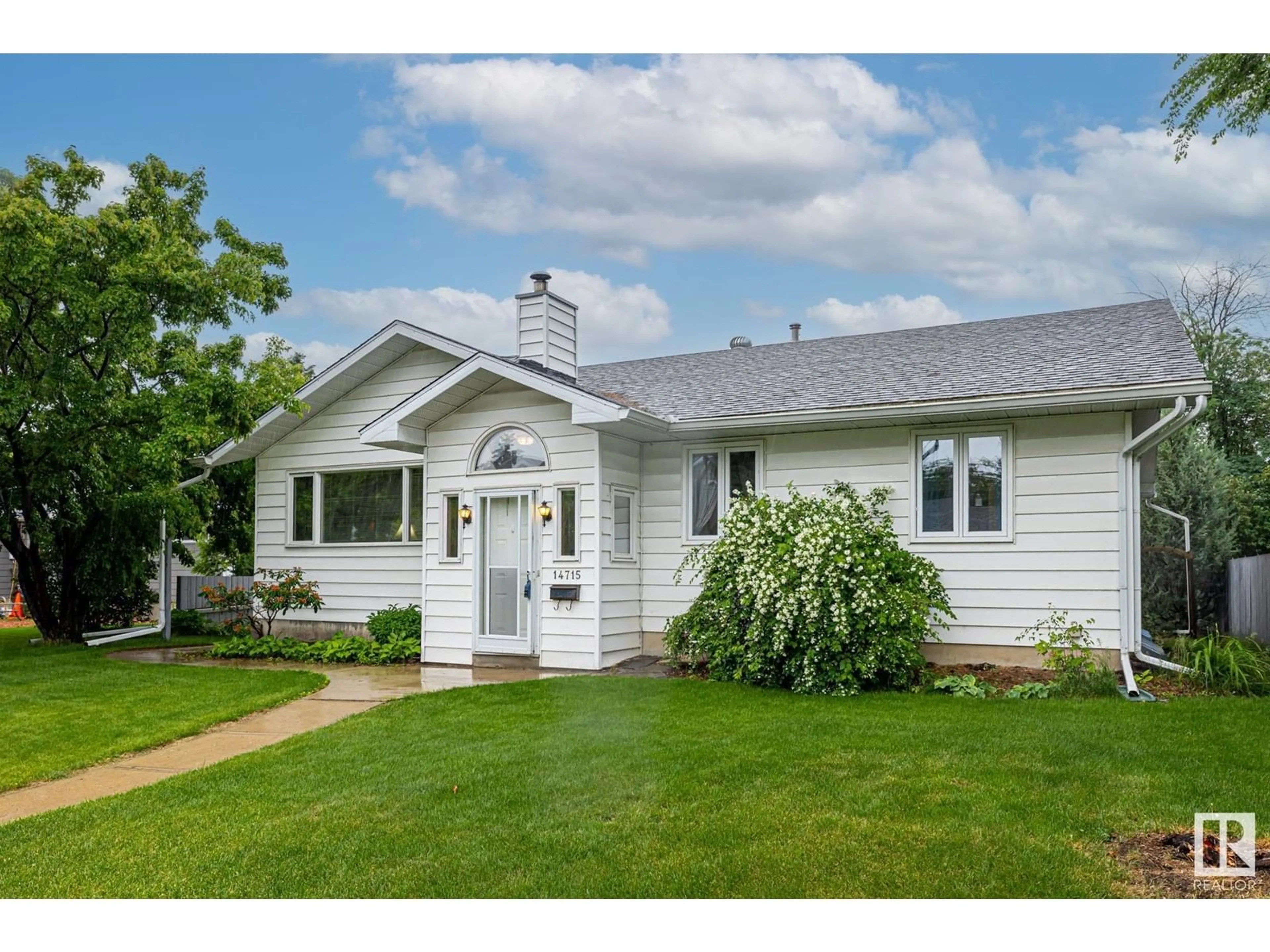 Home with vinyl exterior material, street for 14715 84 AV, Edmonton Alberta T5R3X1