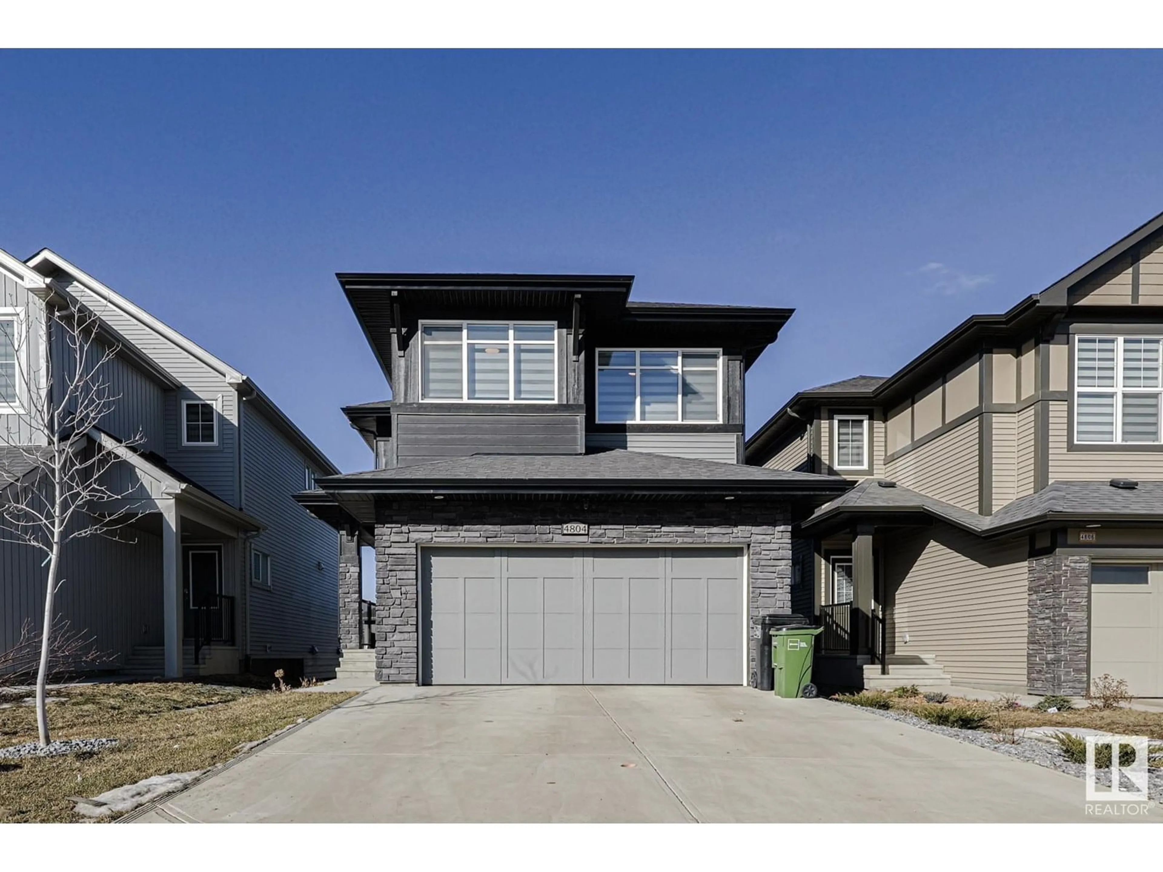 Home with vinyl exterior material, street for 4804 KINNEY RD, Edmonton Alberta T6W5G2