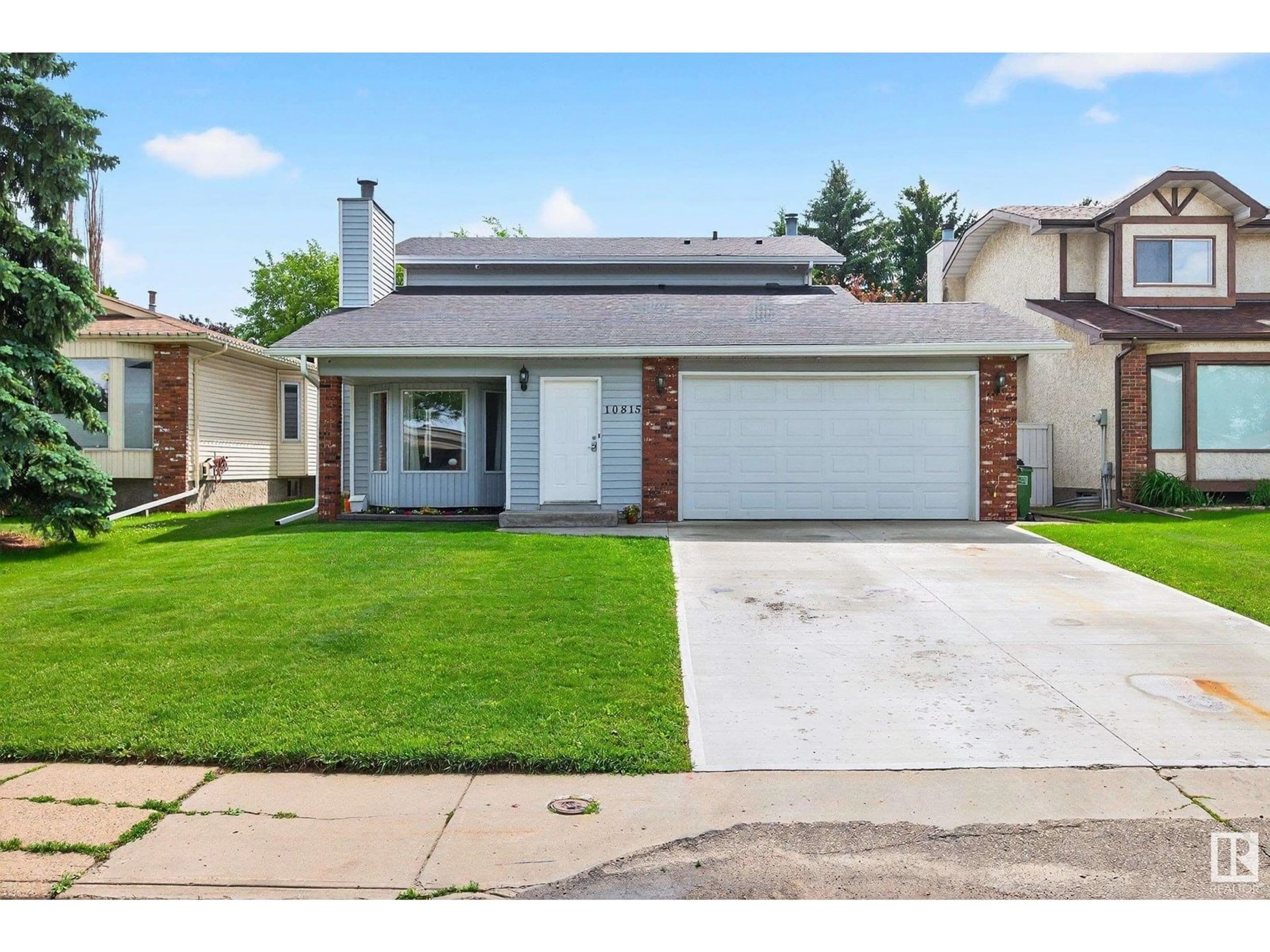 Home with vinyl exterior material, street for 10815 11 AV NW, Edmonton Alberta T6J6M2