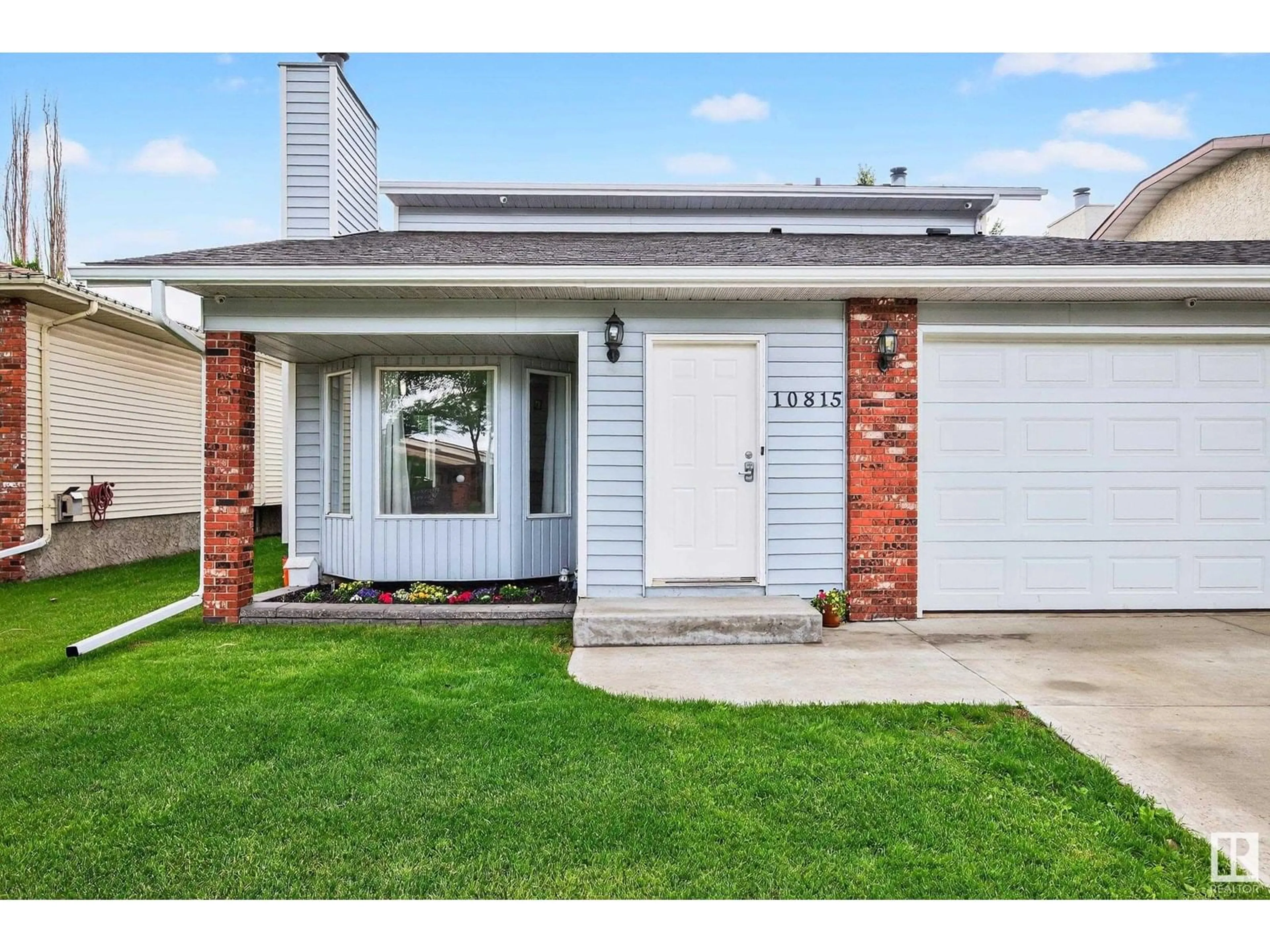Home with vinyl exterior material, street for 10815 11 AV NW, Edmonton Alberta T6J6M2