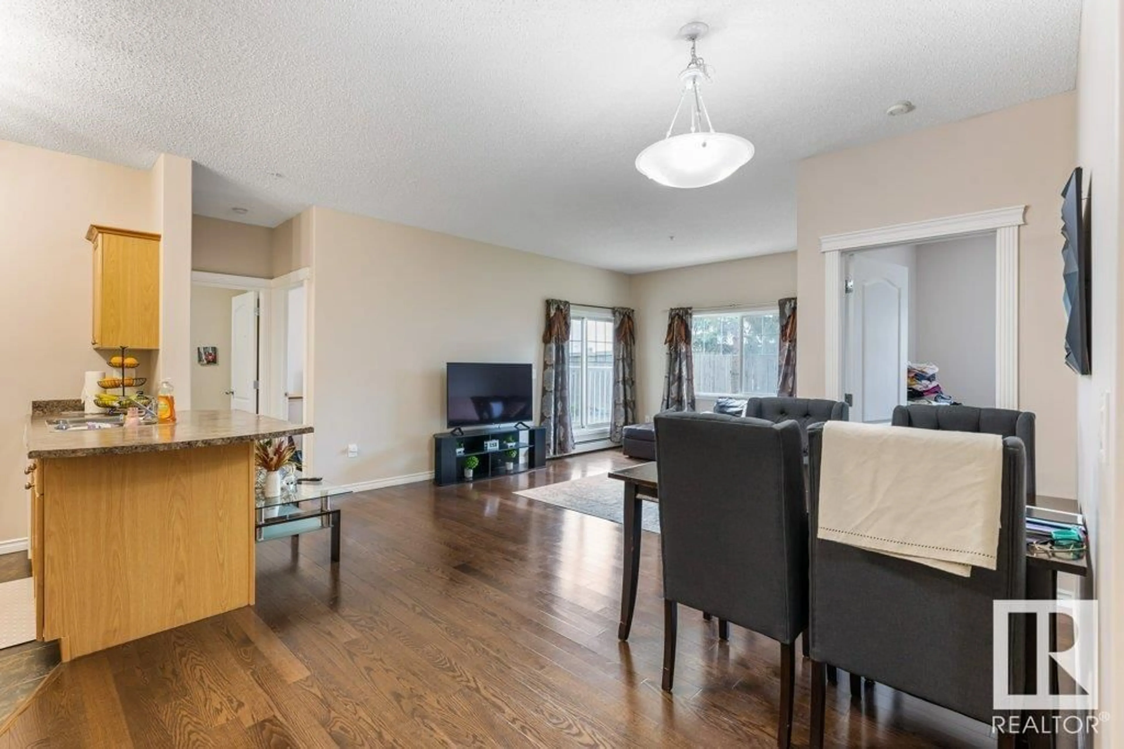 Living room with furniture, wood/laminate floor for #135 - 16807 100 AV, Edmonton Alberta T5P4Z6