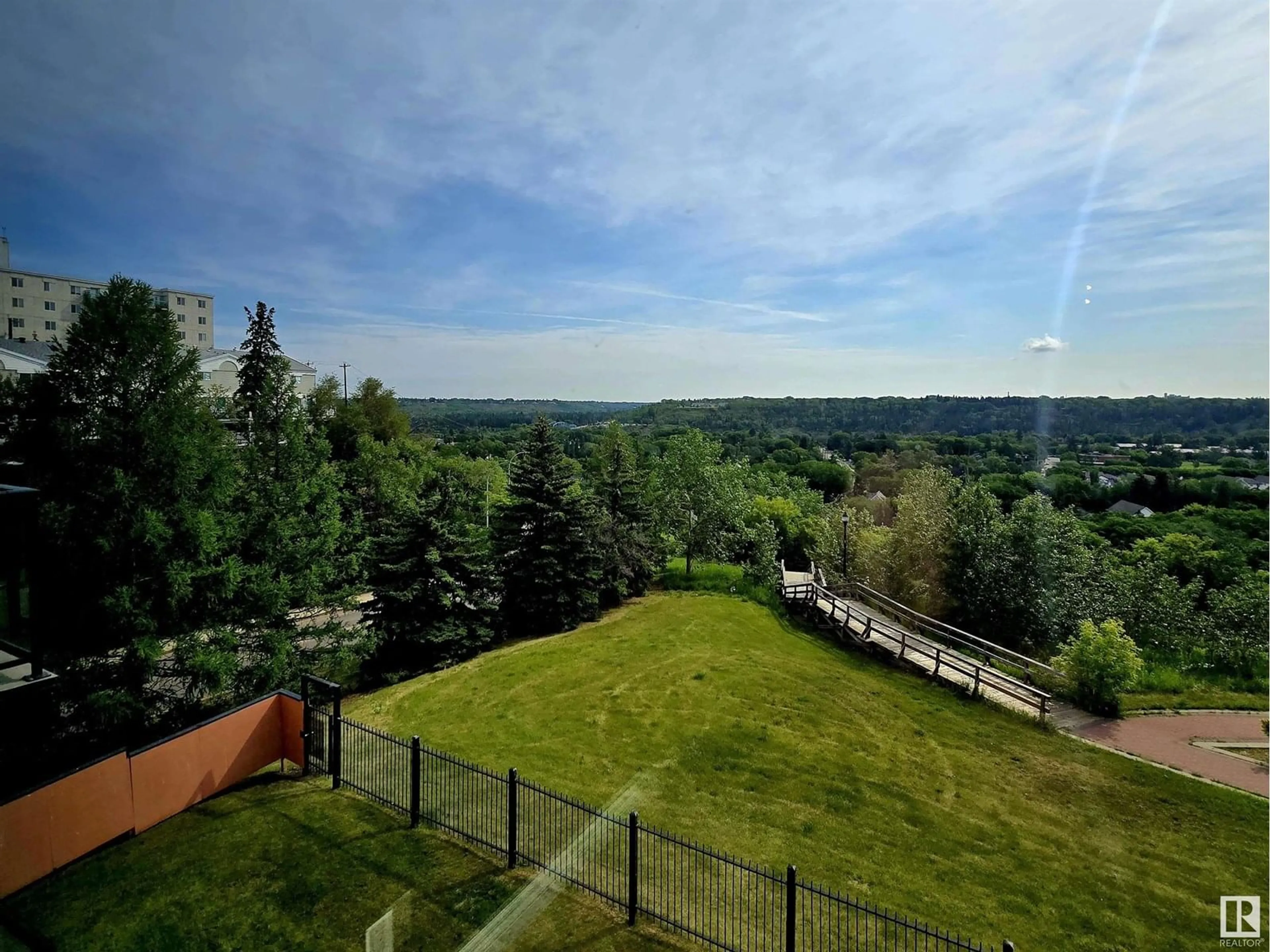 A pic from outside/outdoor area/front of a property/back of a property/a pic from drone, forest/trees view for #214 - 10105 95 ST, Edmonton Alberta T5H4M4