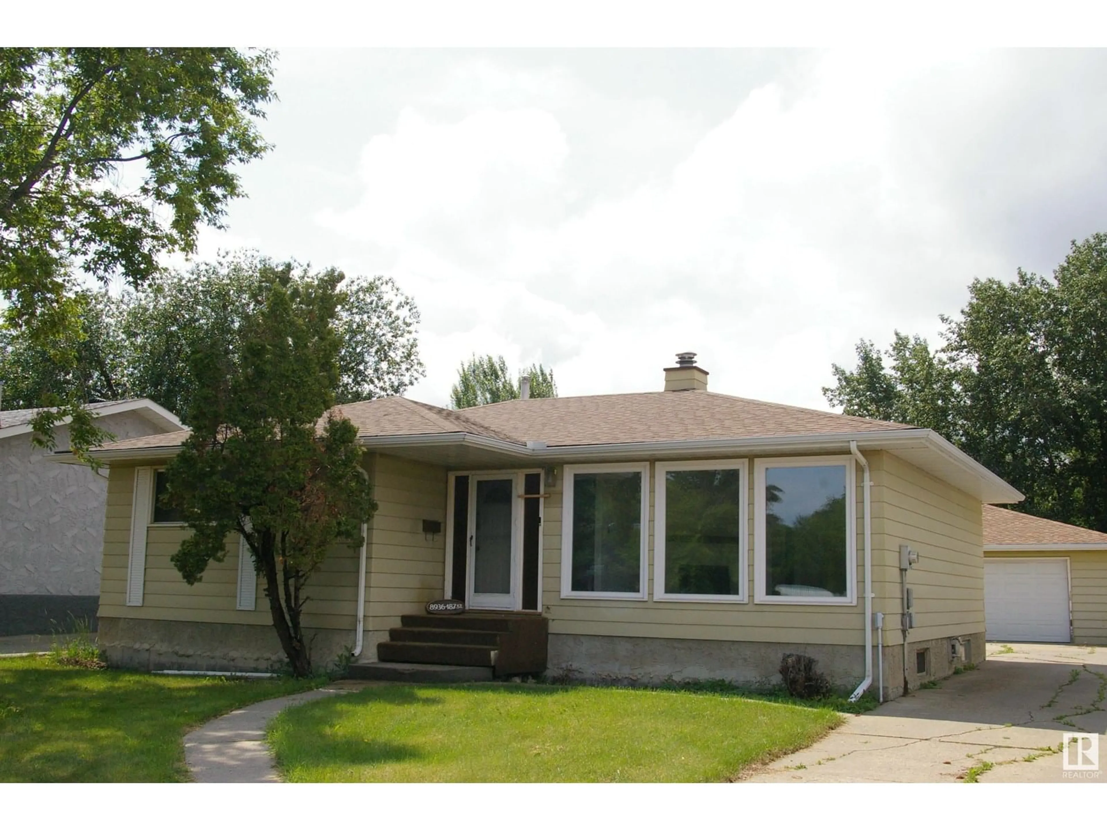 Home with vinyl exterior material, street for NW - 8936 187 ST, Edmonton Alberta T5T1S1