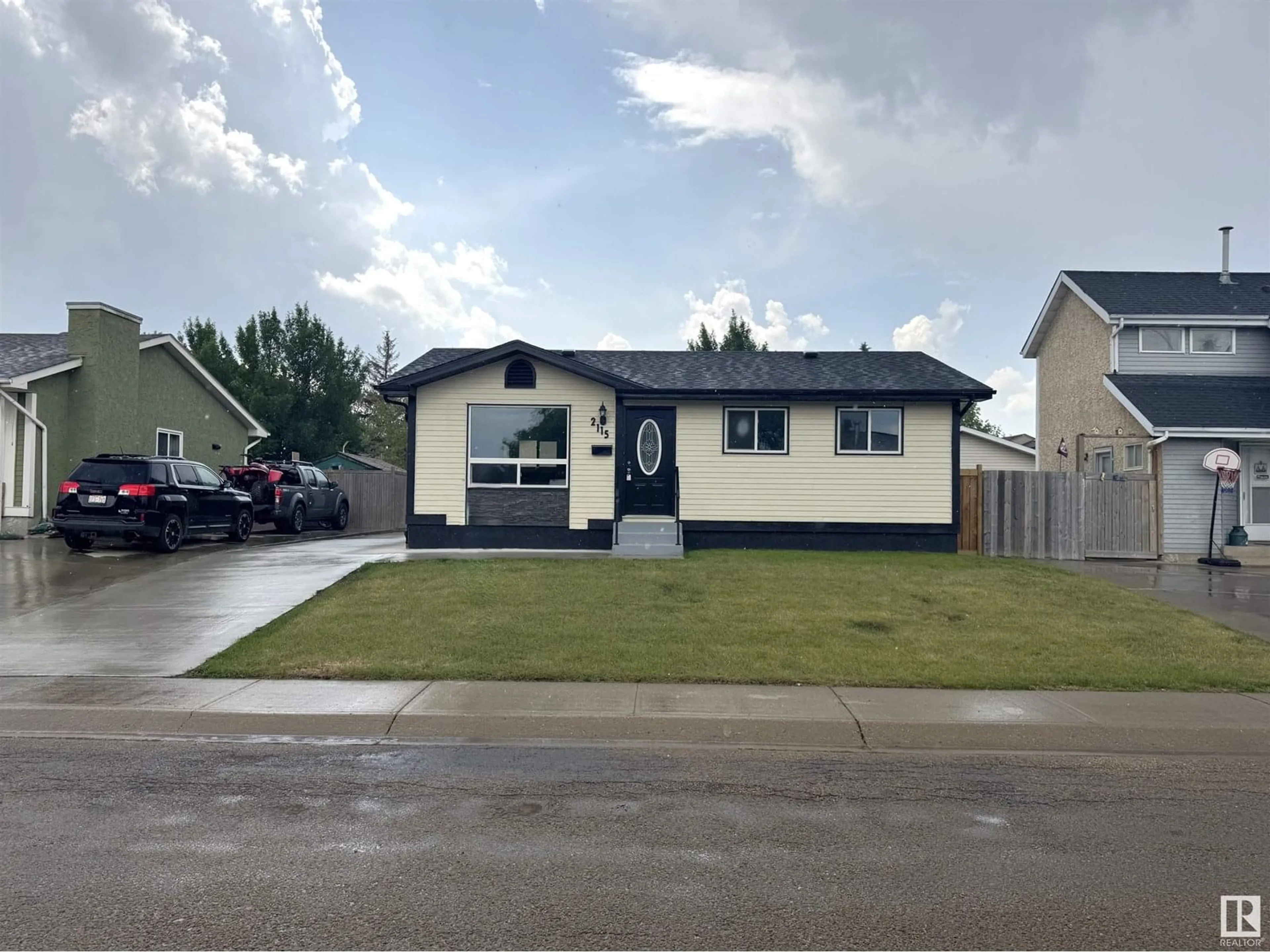 Home with vinyl exterior material, street for 2115 145 AV, Edmonton Alberta T5Y1V1