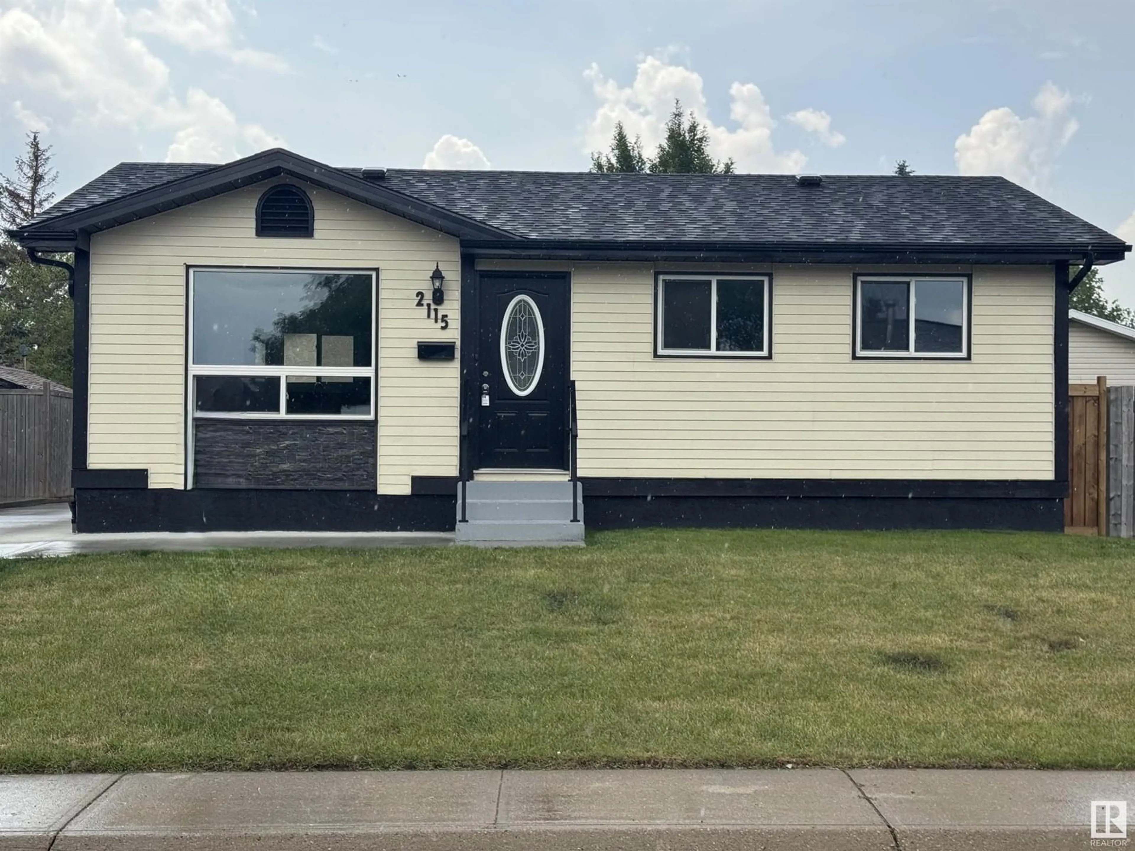 Home with vinyl exterior material, street for 2115 145 AV, Edmonton Alberta T5Y1V1