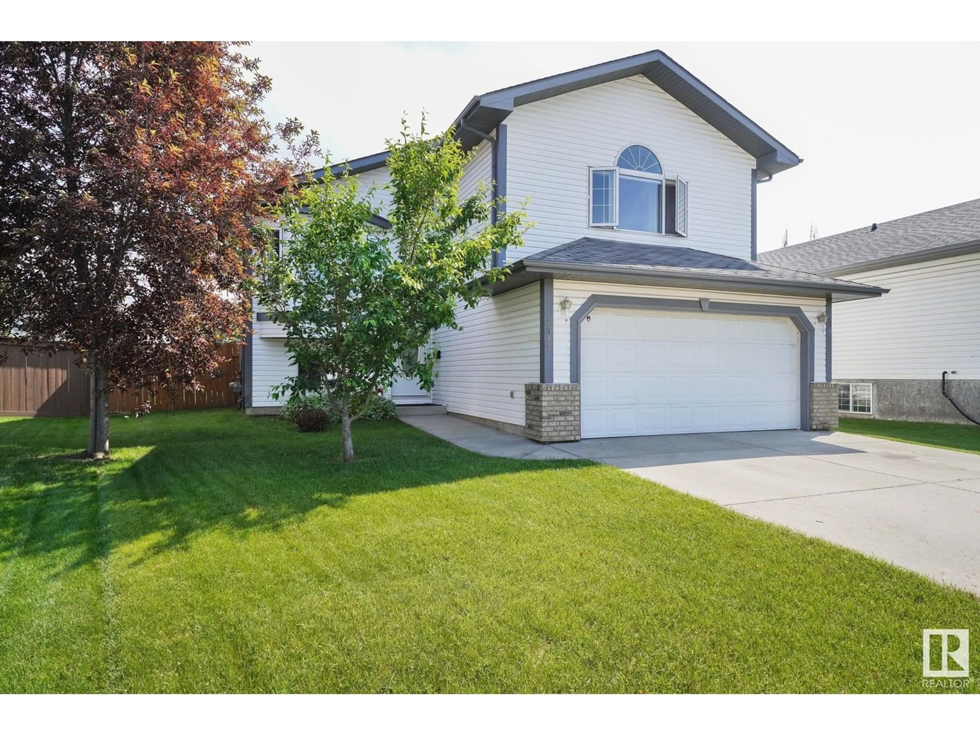 Home with vinyl exterior material, street for 2917 152 AV, Edmonton Alberta T5Y2Y4