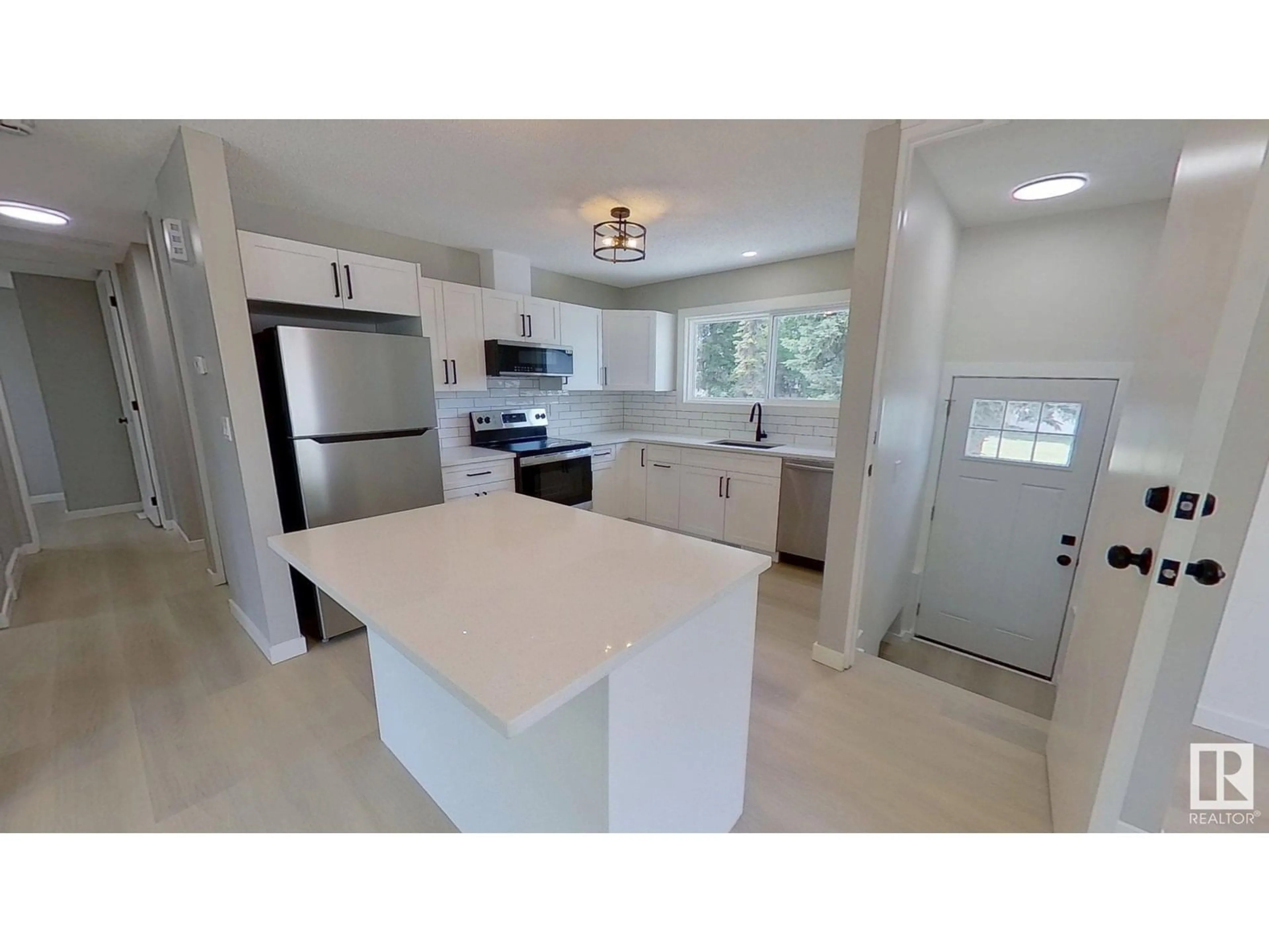 Open concept kitchen, ceramic/tile floor for 8920 92 AV, Fort Saskatchewan Alberta T8L2M4