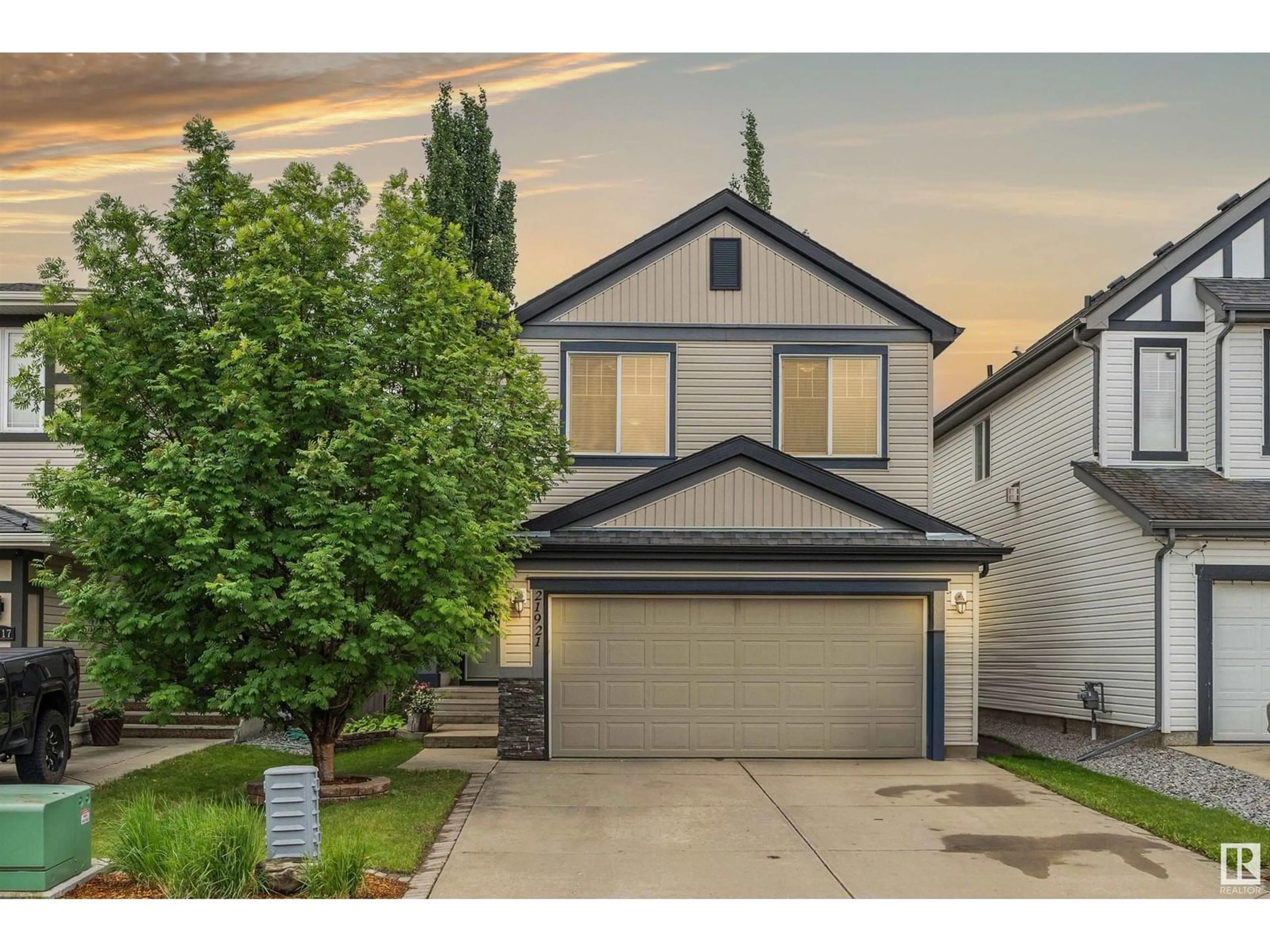 Home with vinyl exterior material, street for 21921 94A AV, Edmonton Alberta T5T1N1
