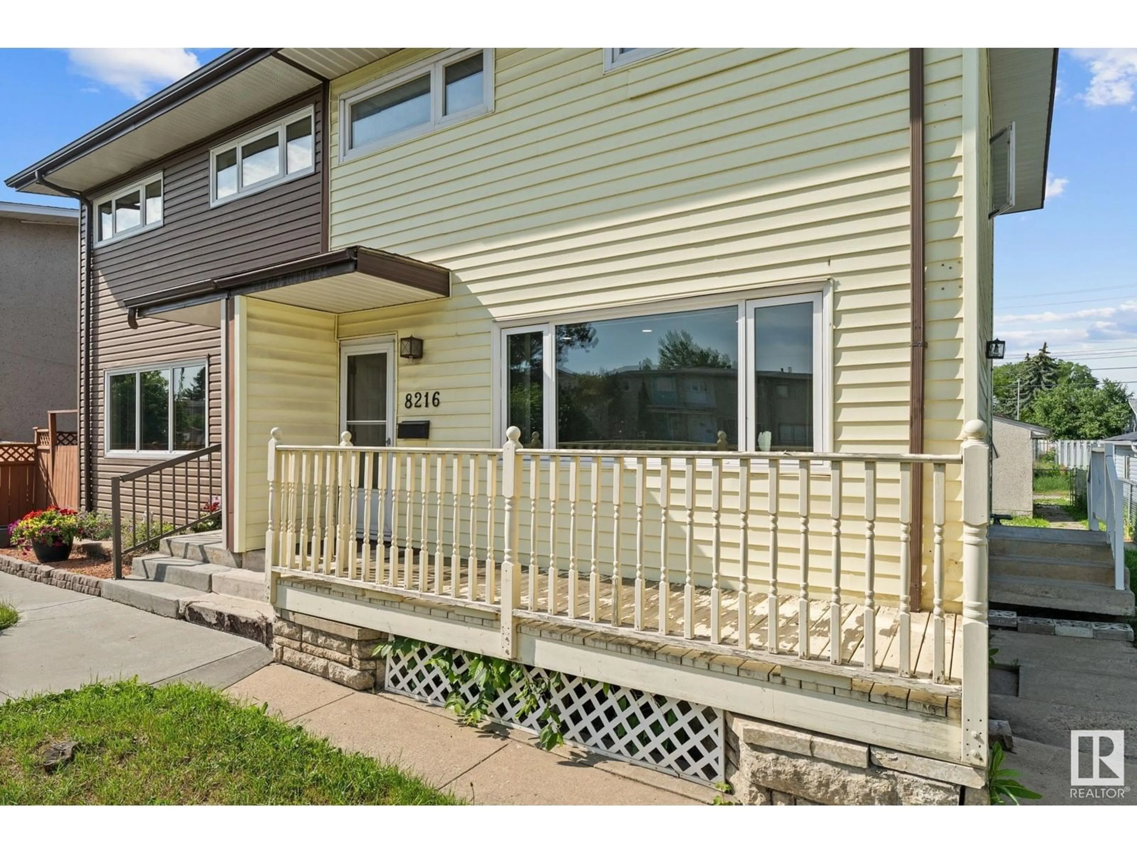 Home with vinyl exterior material, street for 8216 133A AV, Edmonton Alberta T5E1E9