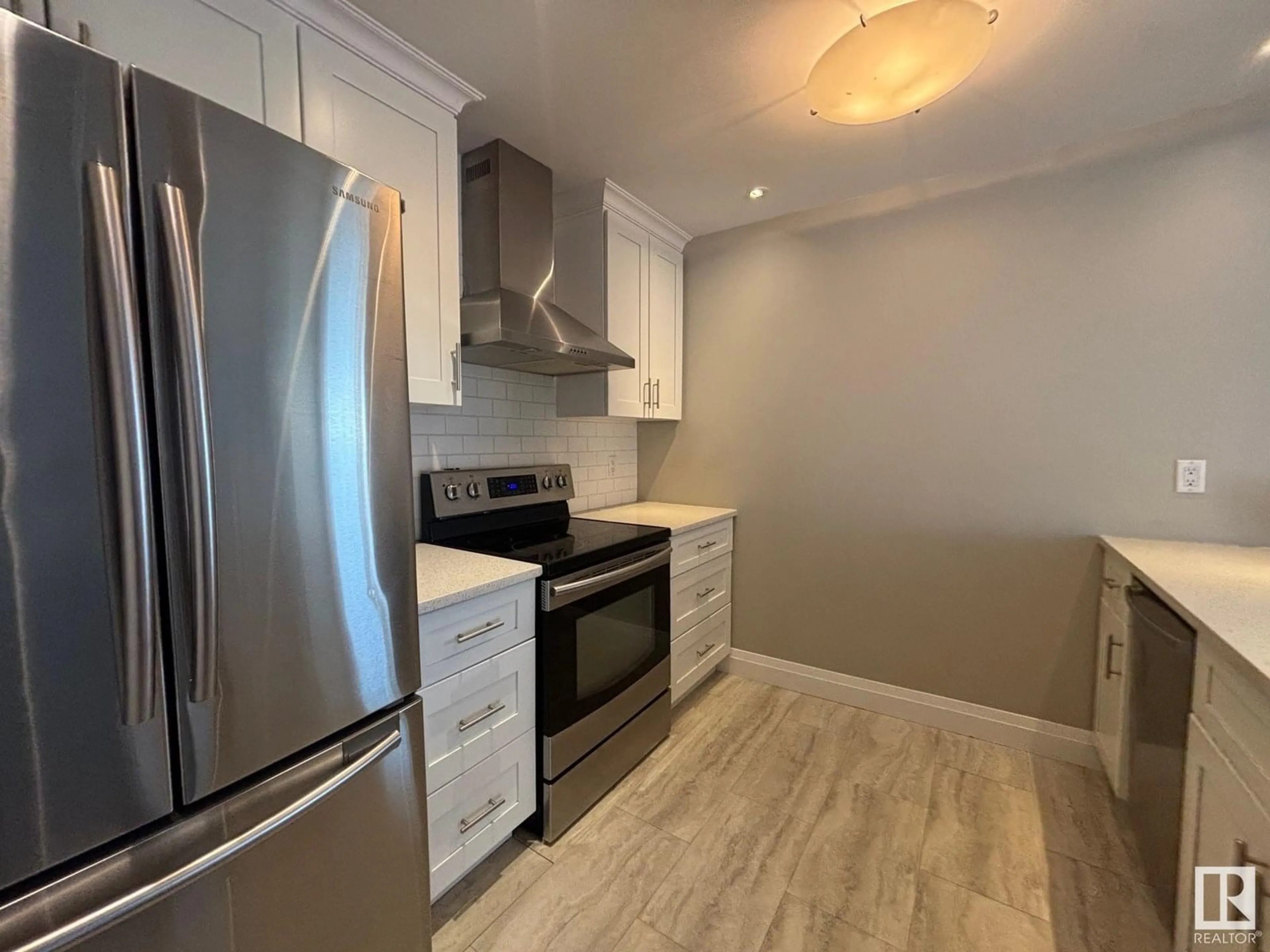 Open concept kitchen, wood/laminate floor for 5979 40 AV, Edmonton Alberta T6L3P6