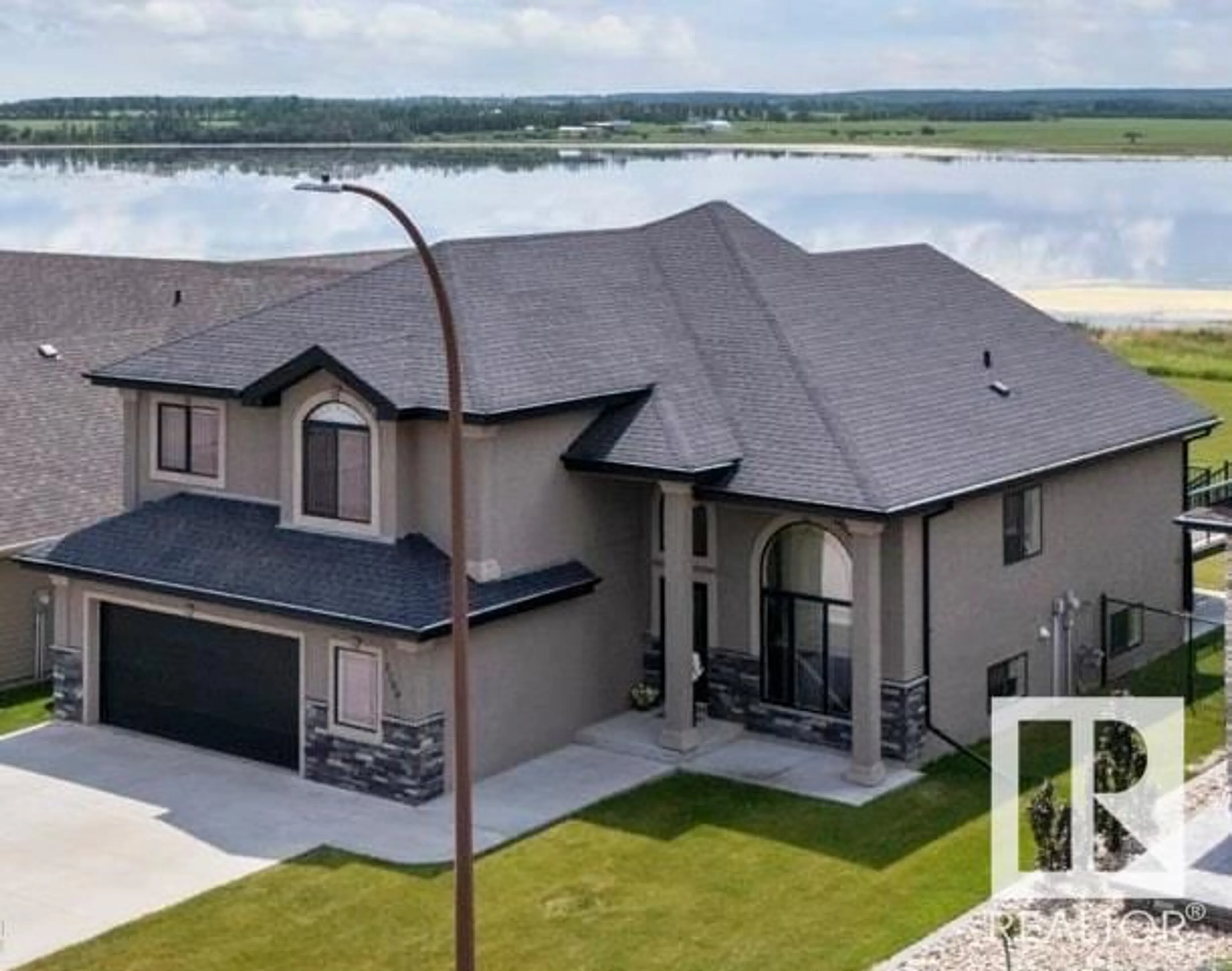 A pic from outside/outdoor area/front of a property/back of a property/a pic from drone, water/lake/river/ocean view for 3704 LAKESHORE DR, Bonnyville Town Alberta T9N0A4