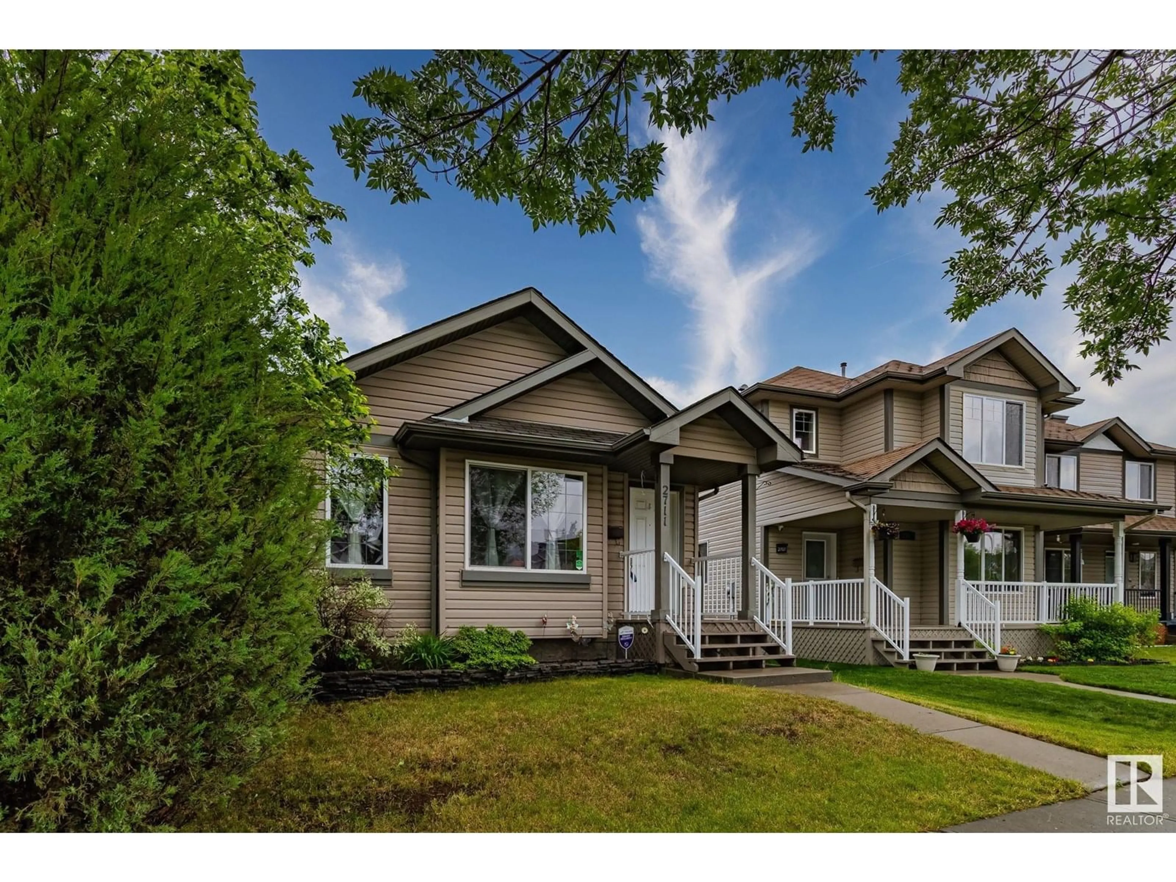 Home with vinyl exterior material, street for 2711 24 ST, Edmonton Alberta T6T0A4