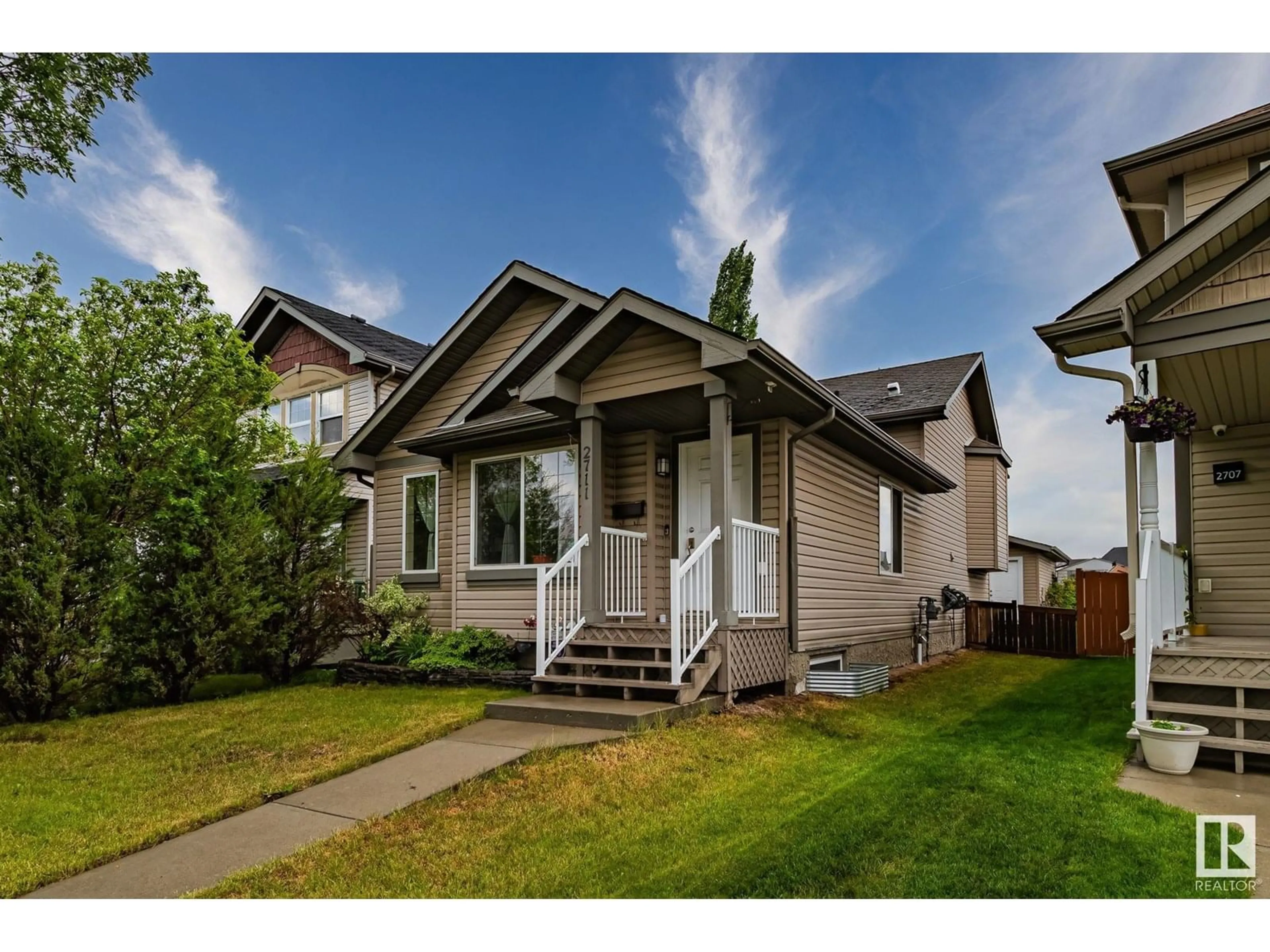 Home with vinyl exterior material, street for 2711 24 ST, Edmonton Alberta T6T0A4