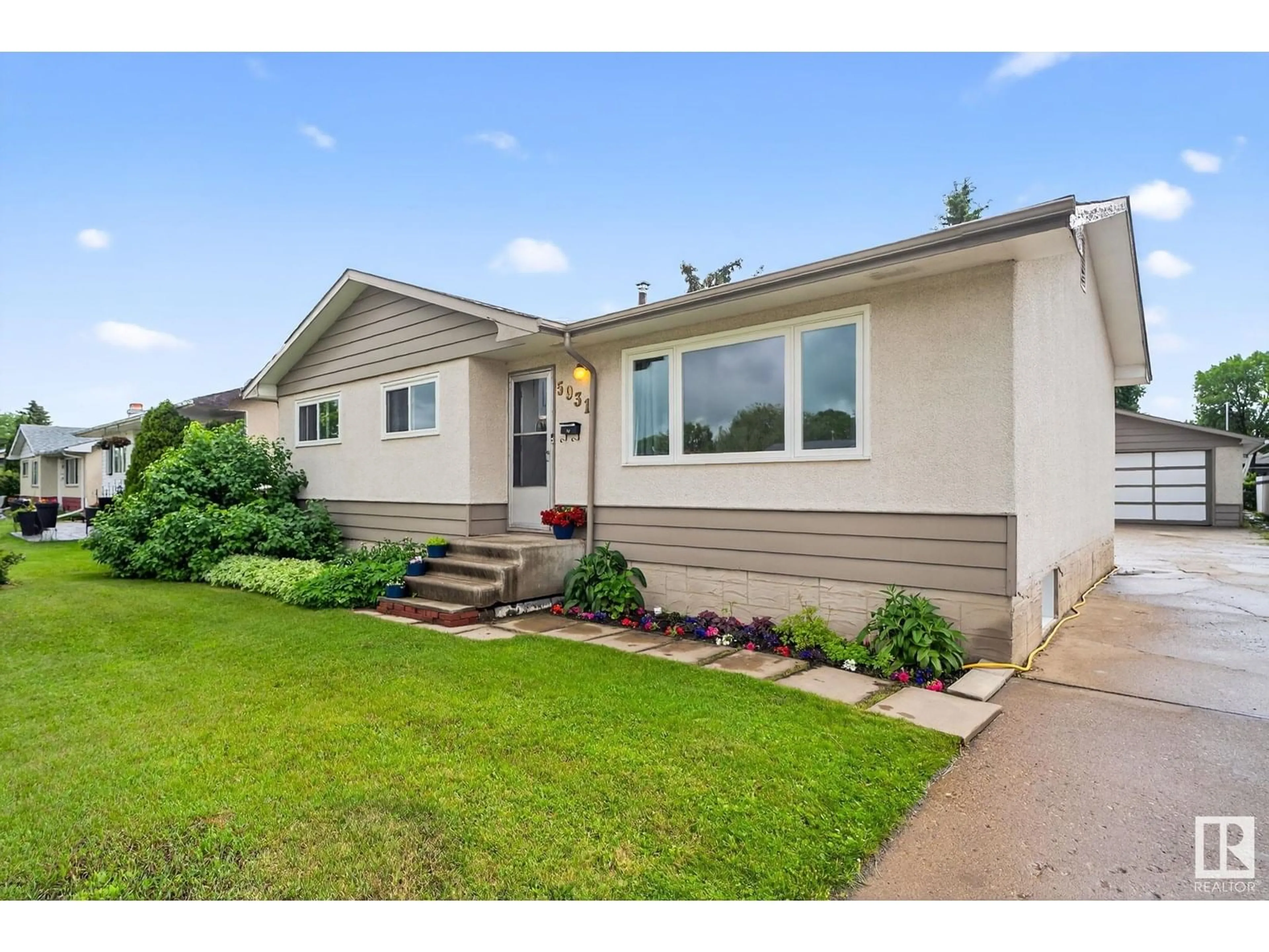Home with vinyl exterior material, street for 5931 149 AV, Edmonton Alberta T5A1V7