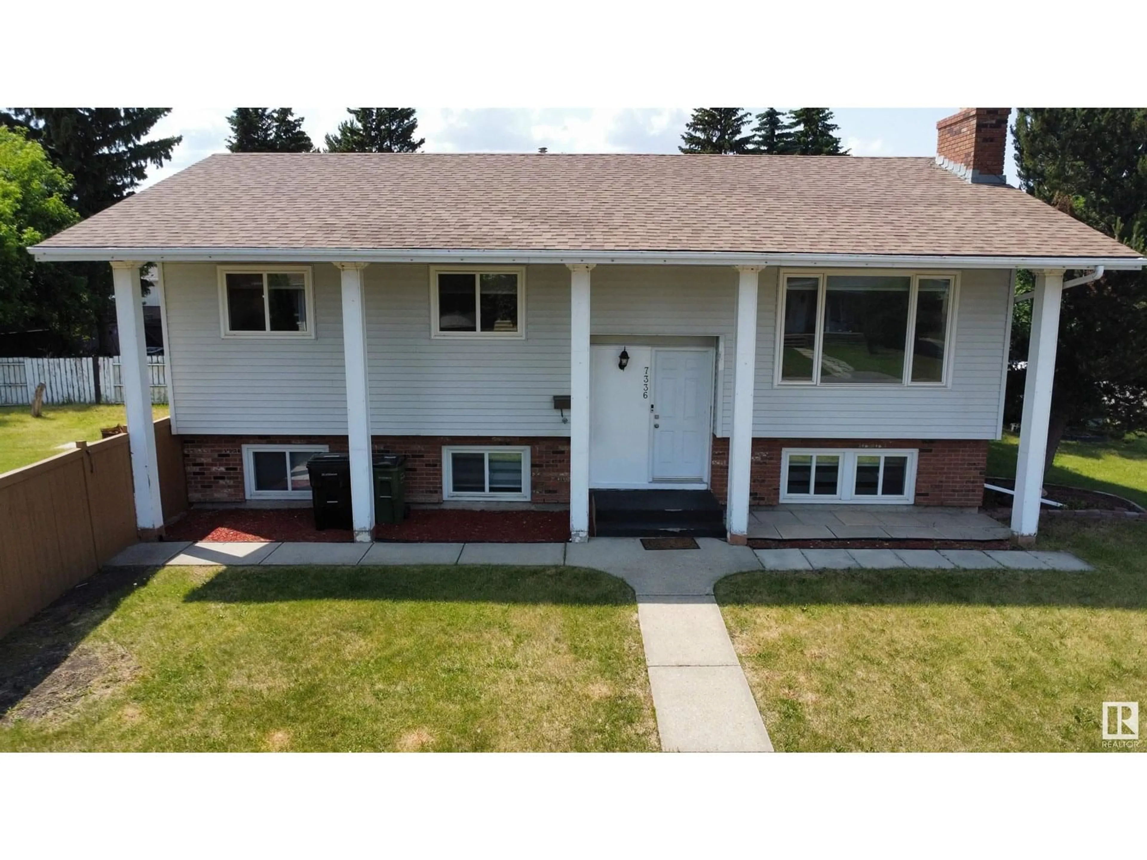 Home with vinyl exterior material, street for NW - 7336 21 AV, Edmonton Alberta T6K2C4