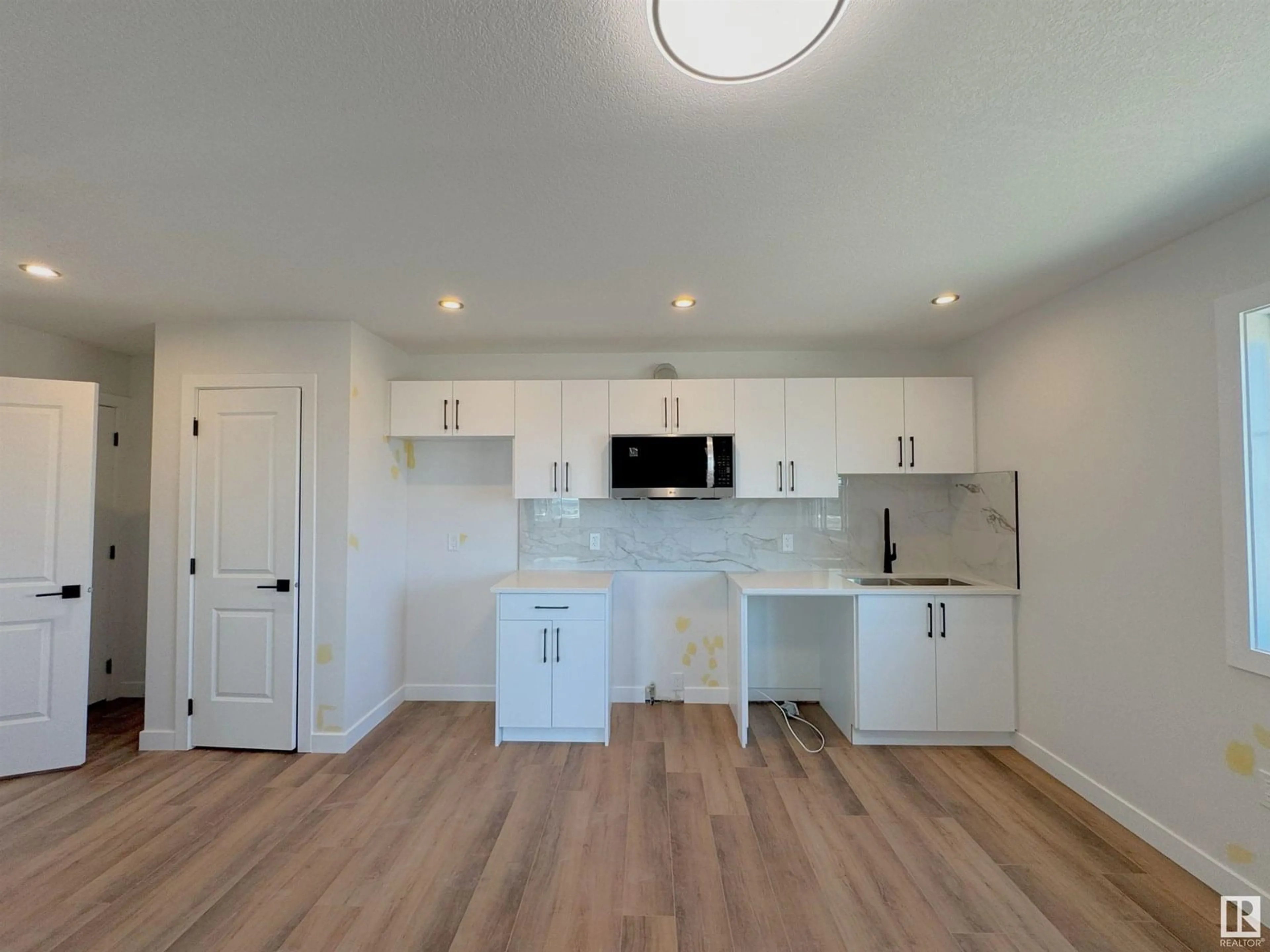 Open concept kitchen, wood/laminate floor for 741 MATTSON DR, Edmonton Alberta T6X3G3