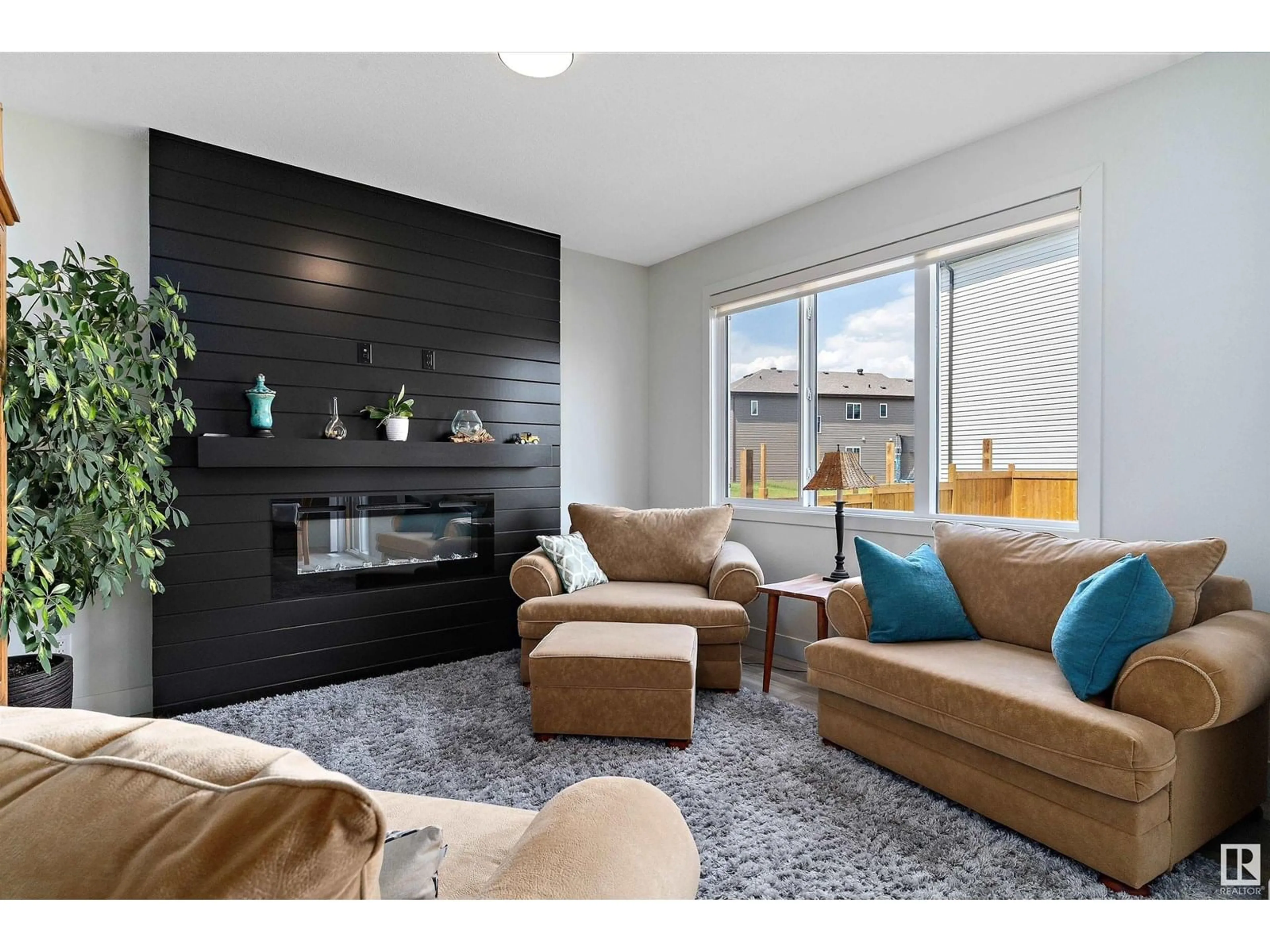 Living room with furniture, wood/laminate floor for 3804 - 3804 42 AV, Beaumont Alberta T4X2Z6