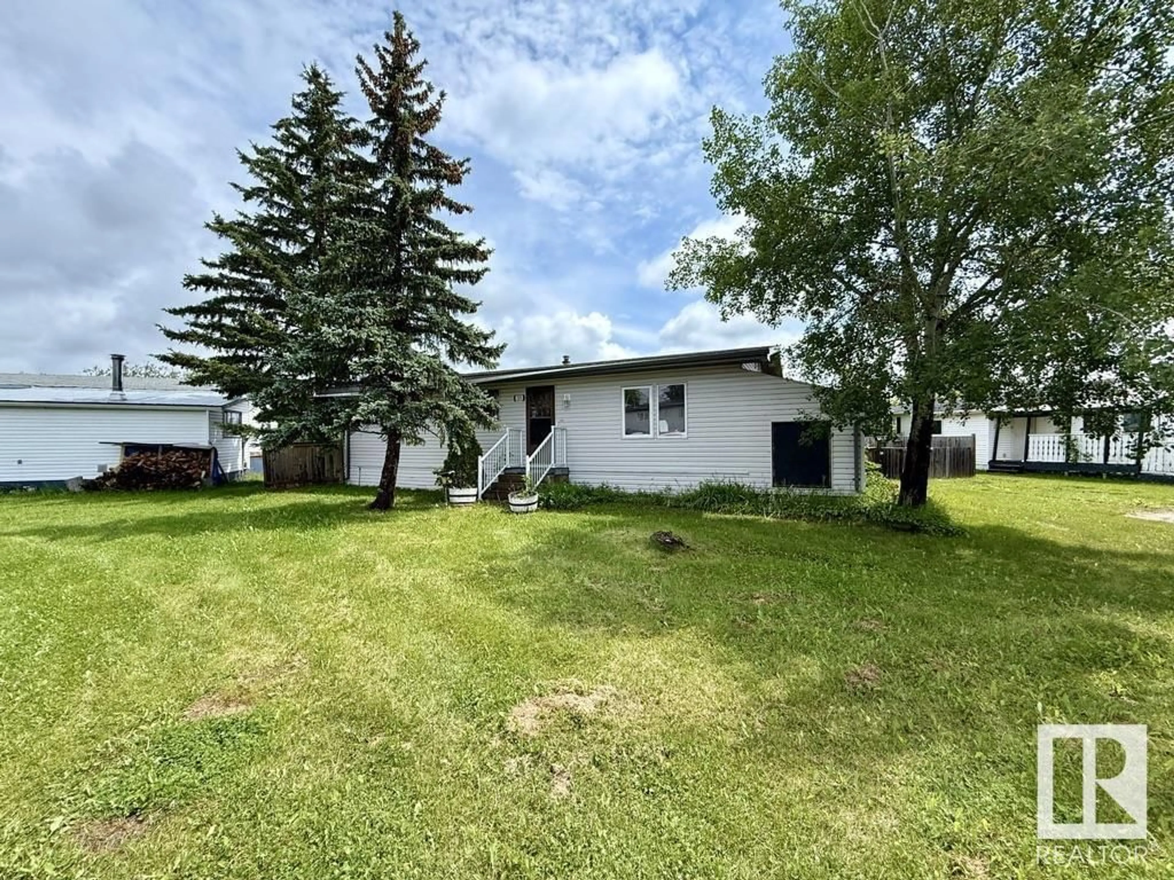 A pic from outside/outdoor area/front of a property/back of a property/a pic from drone, unknown for 313 - 53222 RR 272, Rural Parkland County Alberta T7X3P1