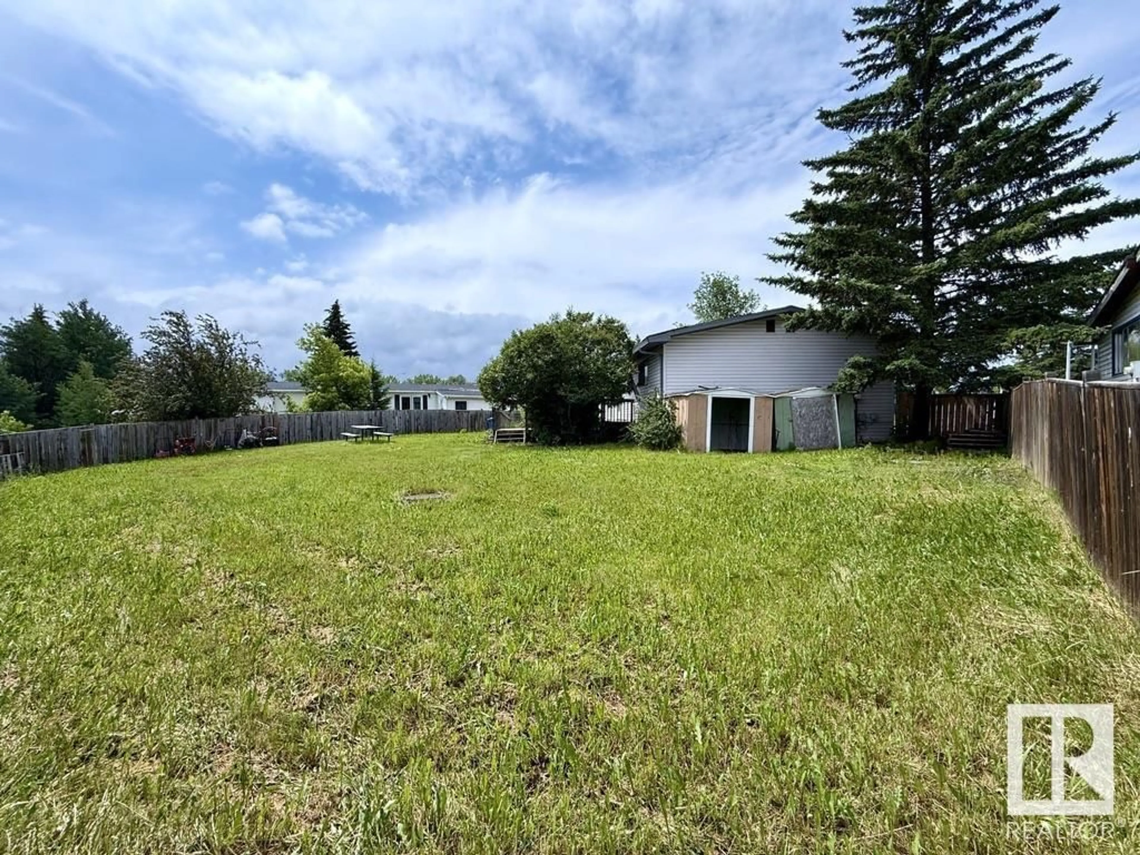 A pic from outside/outdoor area/front of a property/back of a property/a pic from drone, unknown for 313 - 53222 RR 272, Rural Parkland County Alberta T7X3P1