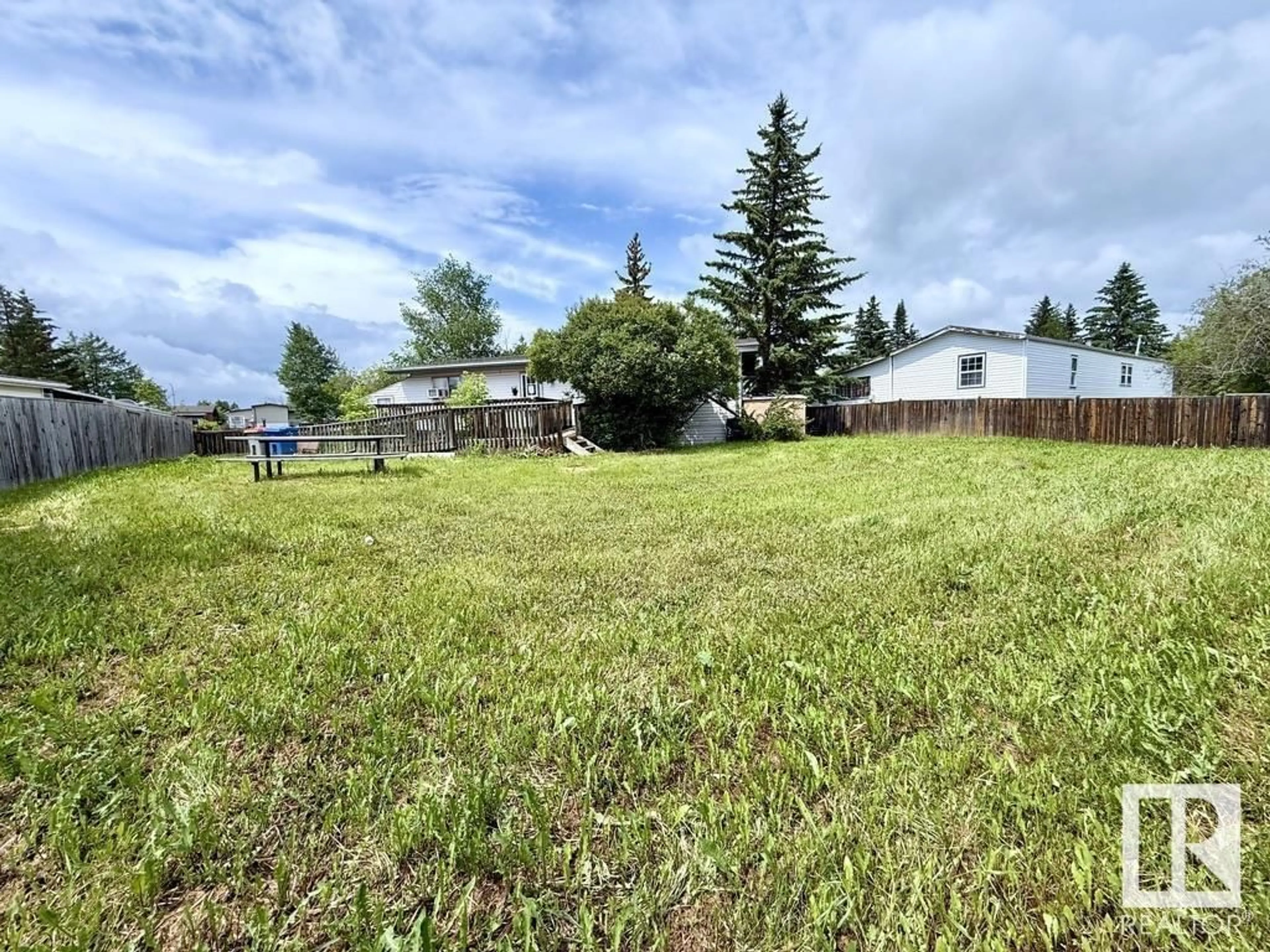 A pic from outside/outdoor area/front of a property/back of a property/a pic from drone, unknown for 313 - 53222 RR 272, Rural Parkland County Alberta T7X3P1