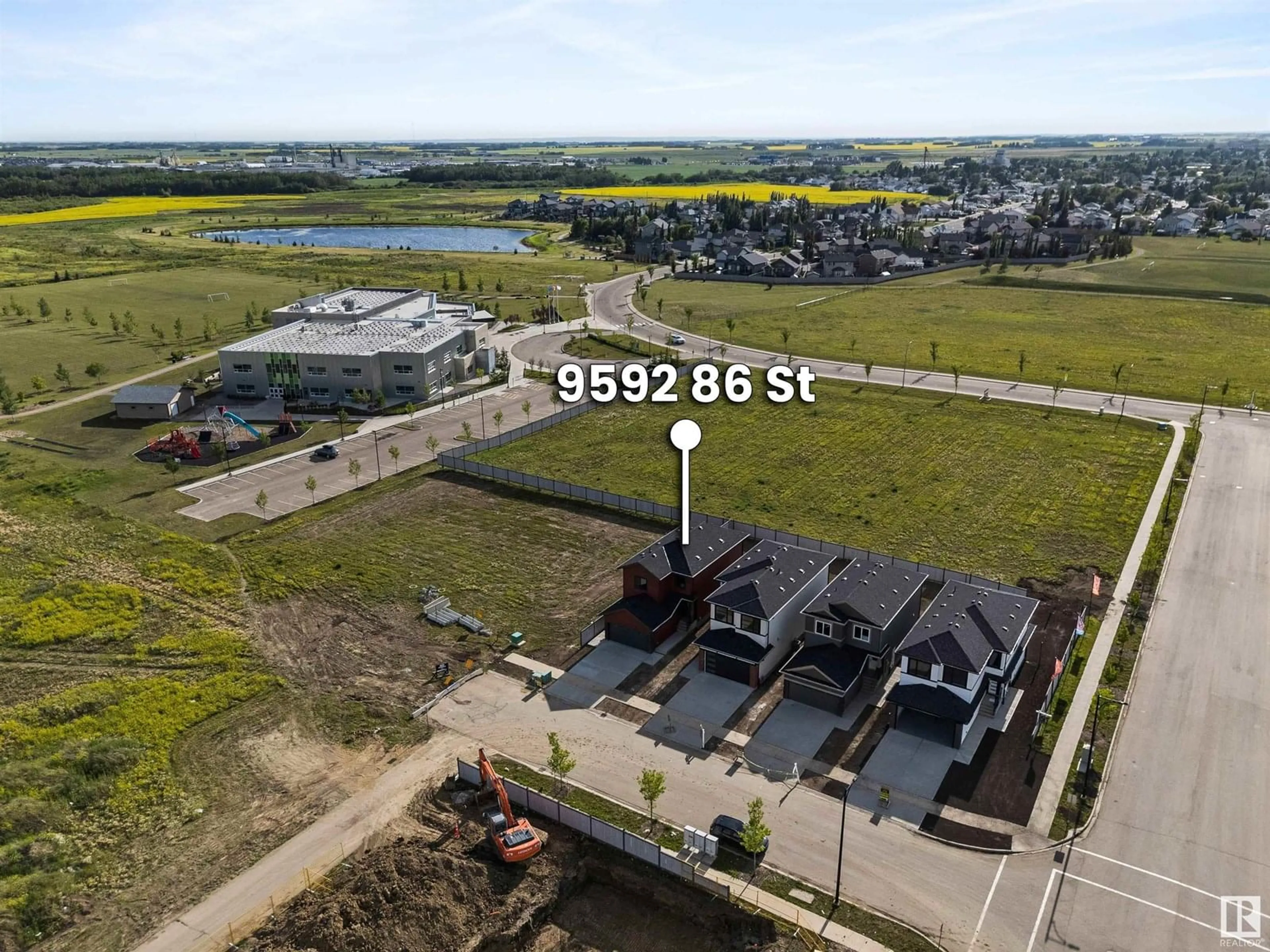 A pic from outside/outdoor area/front of a property/back of a property/a pic from drone, water/lake/river/ocean view for 9592 86 ST, Morinville Alberta T8R1S8