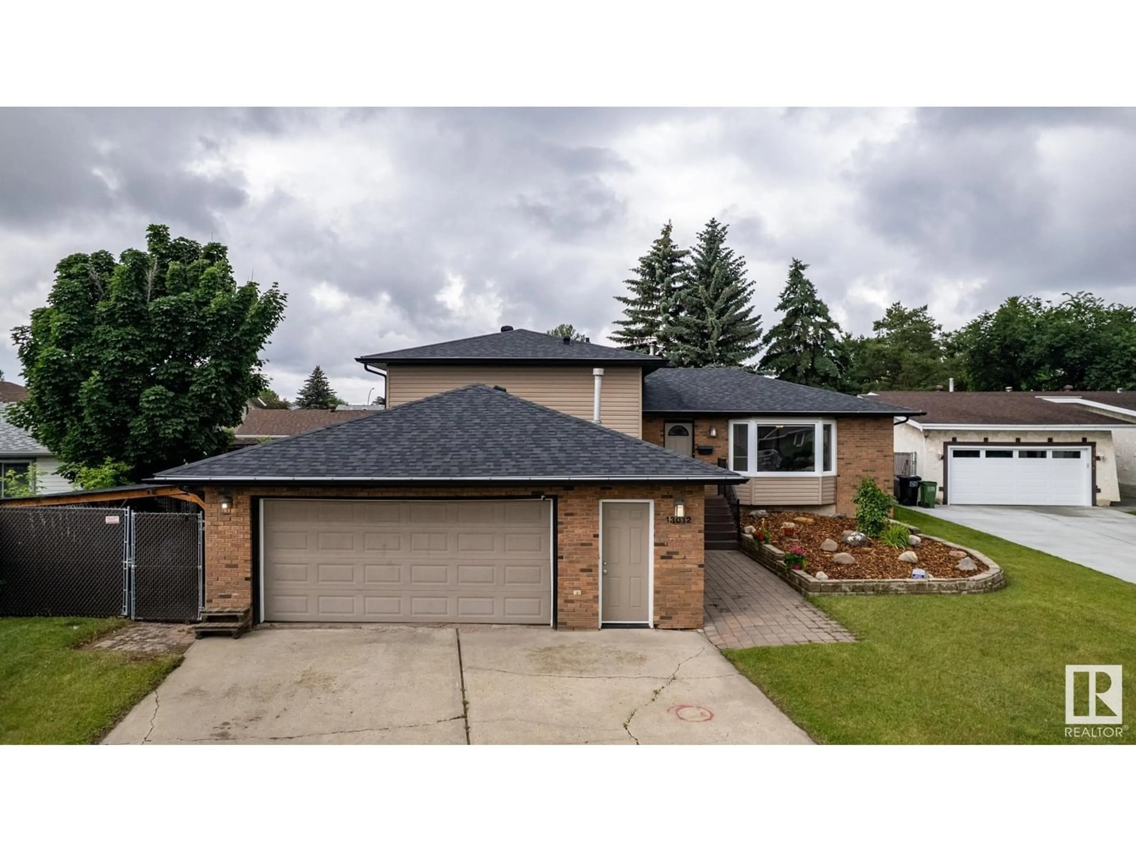 Home with vinyl exterior material, street for 13012 32 ST, Edmonton Alberta T5A3C6