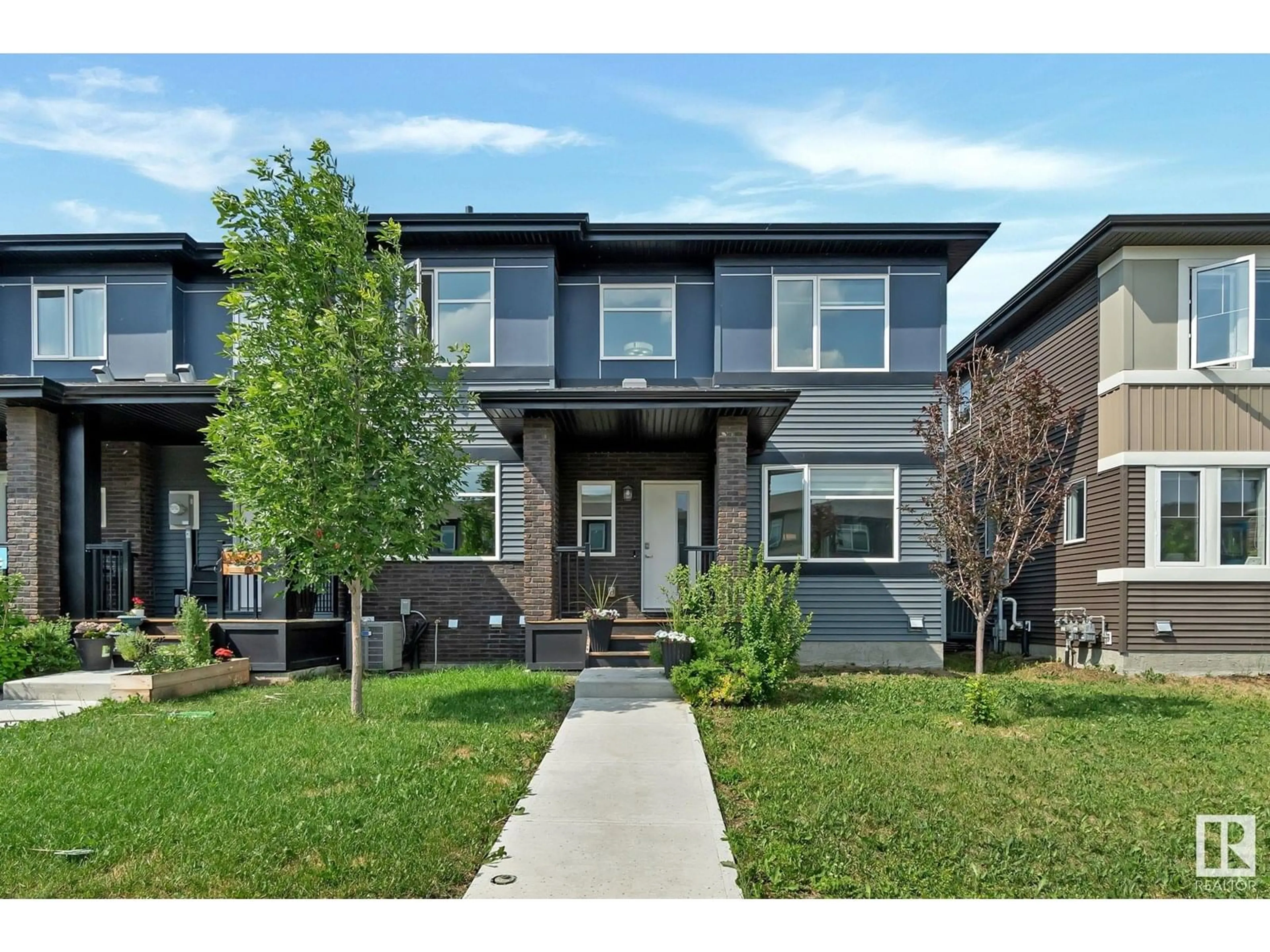 Home with brick exterior material, street for 19720 27 AV, Edmonton Alberta T6M0W9