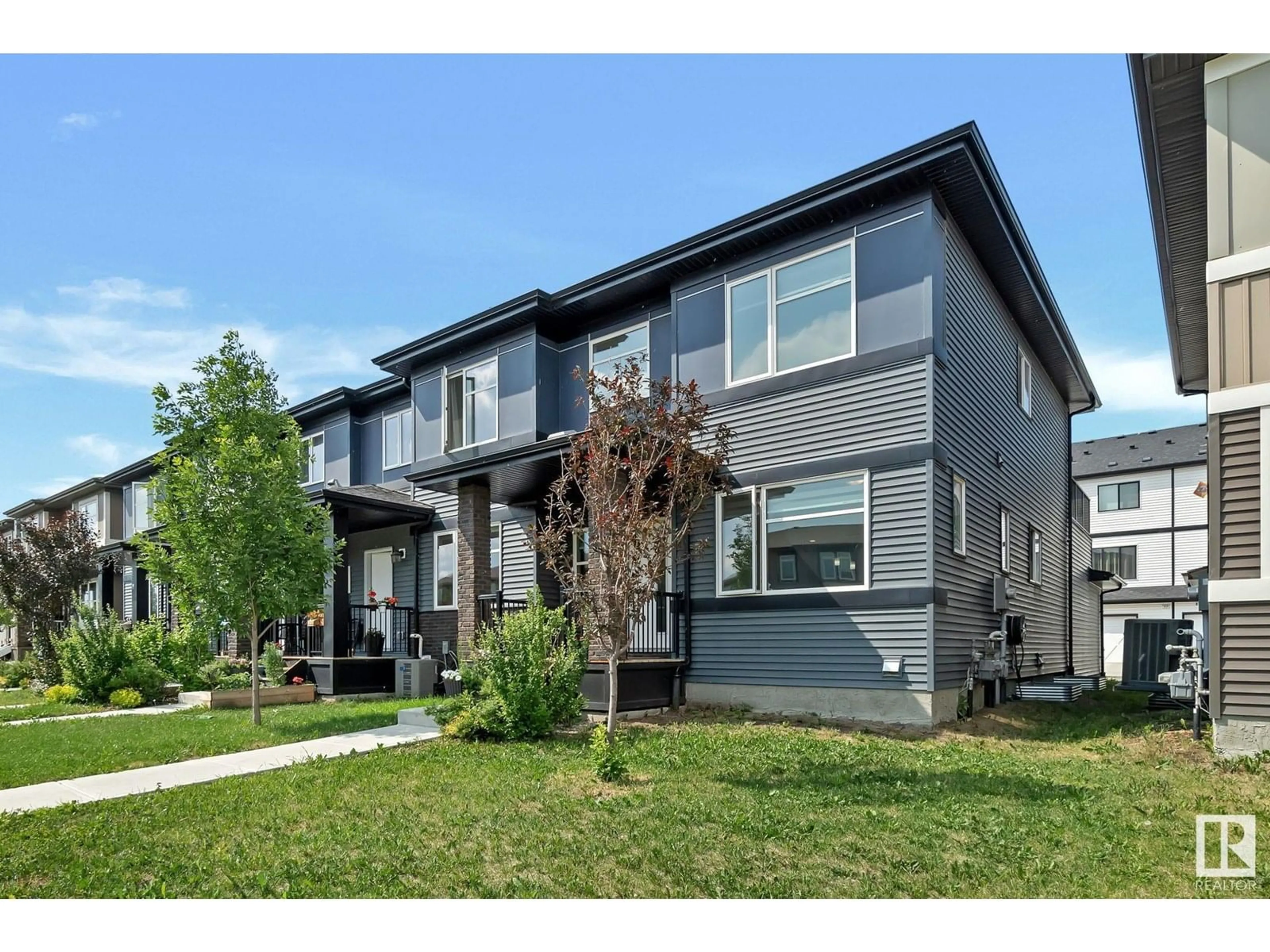 Home with vinyl exterior material, street for 19720 27 AV, Edmonton Alberta T6M0W9