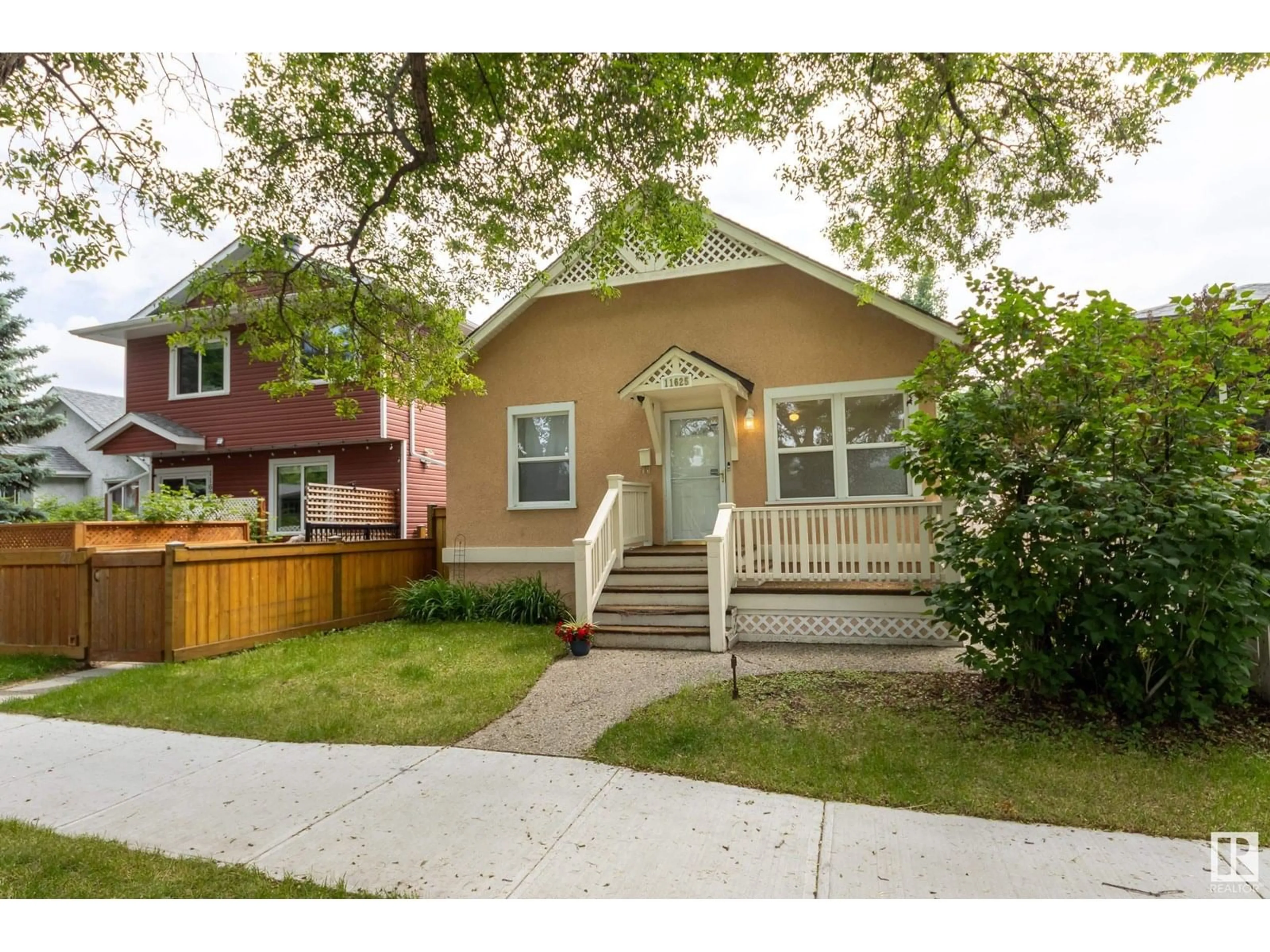 Home with vinyl exterior material, street for NW - 11625 91 ST, Edmonton Alberta T5B4A9