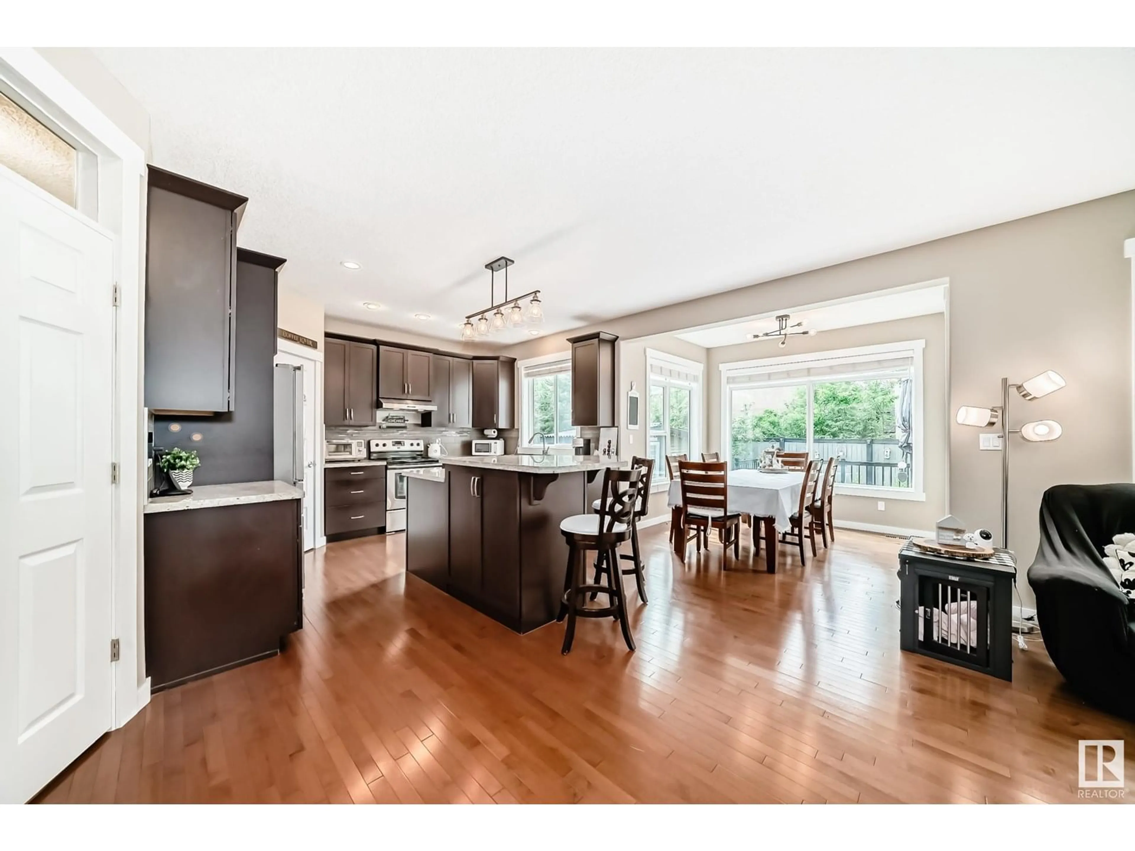 Open concept kitchen, wood/laminate floor for 313 MAGRATH BV, Edmonton Alberta T6R3T7