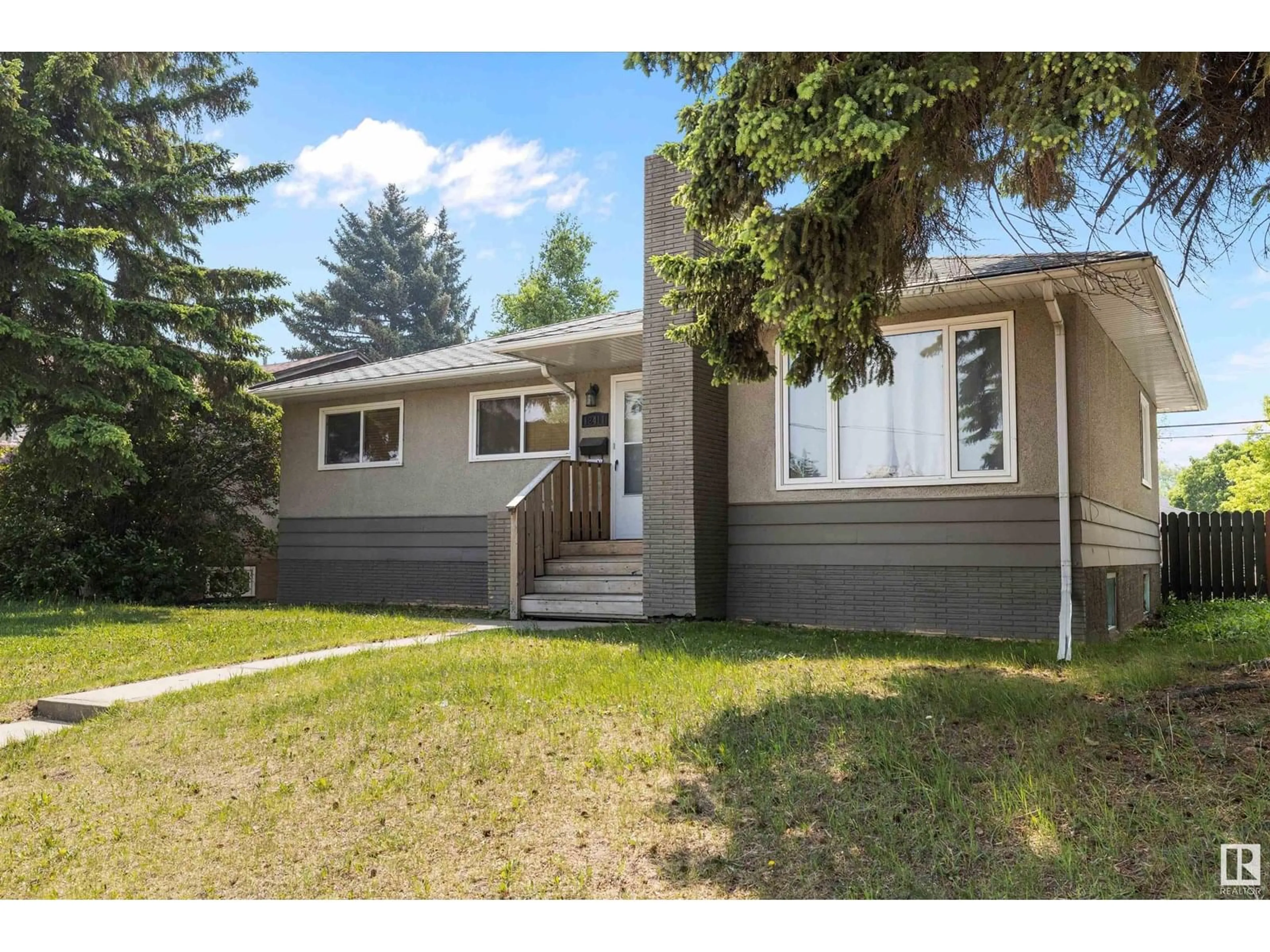 Home with vinyl exterior material, street for 12411 132 AV, Edmonton Alberta T5L3P8